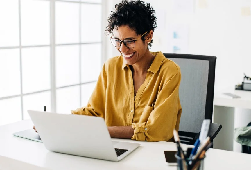smiling business woman on laptop