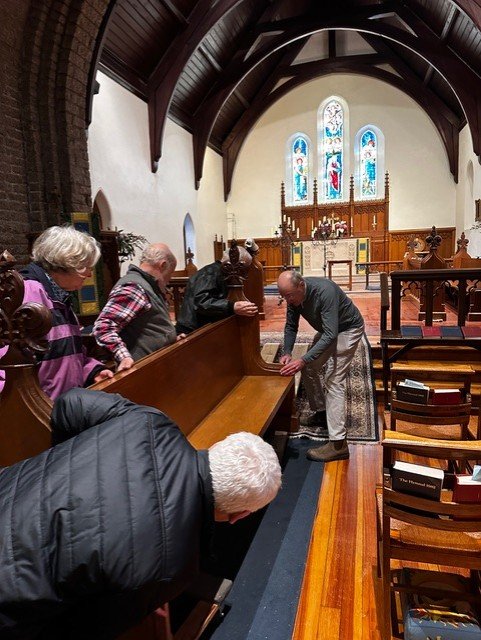 Moving choir benches back to chancel.jpeg