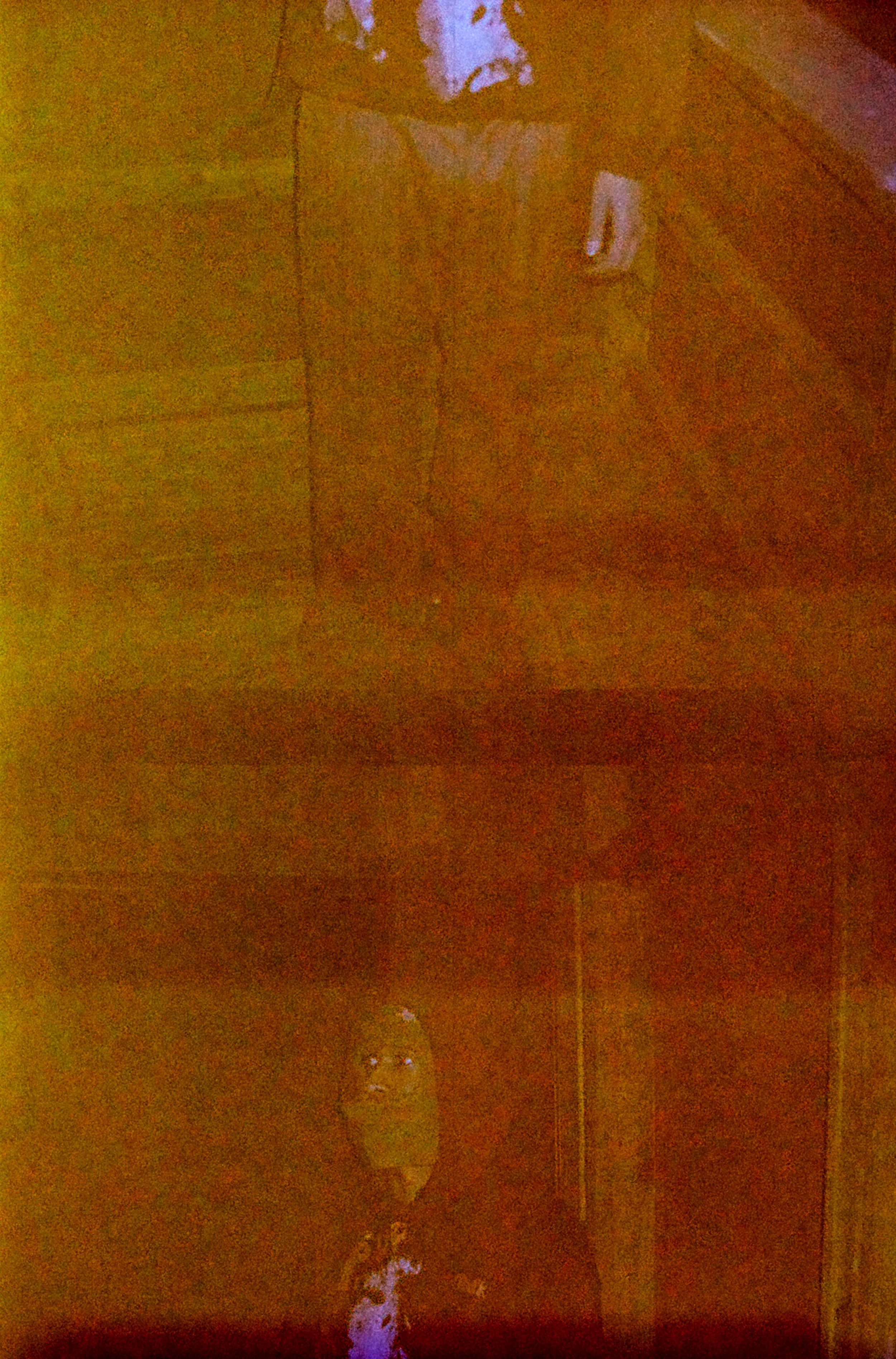 A person in a dimly lit room.