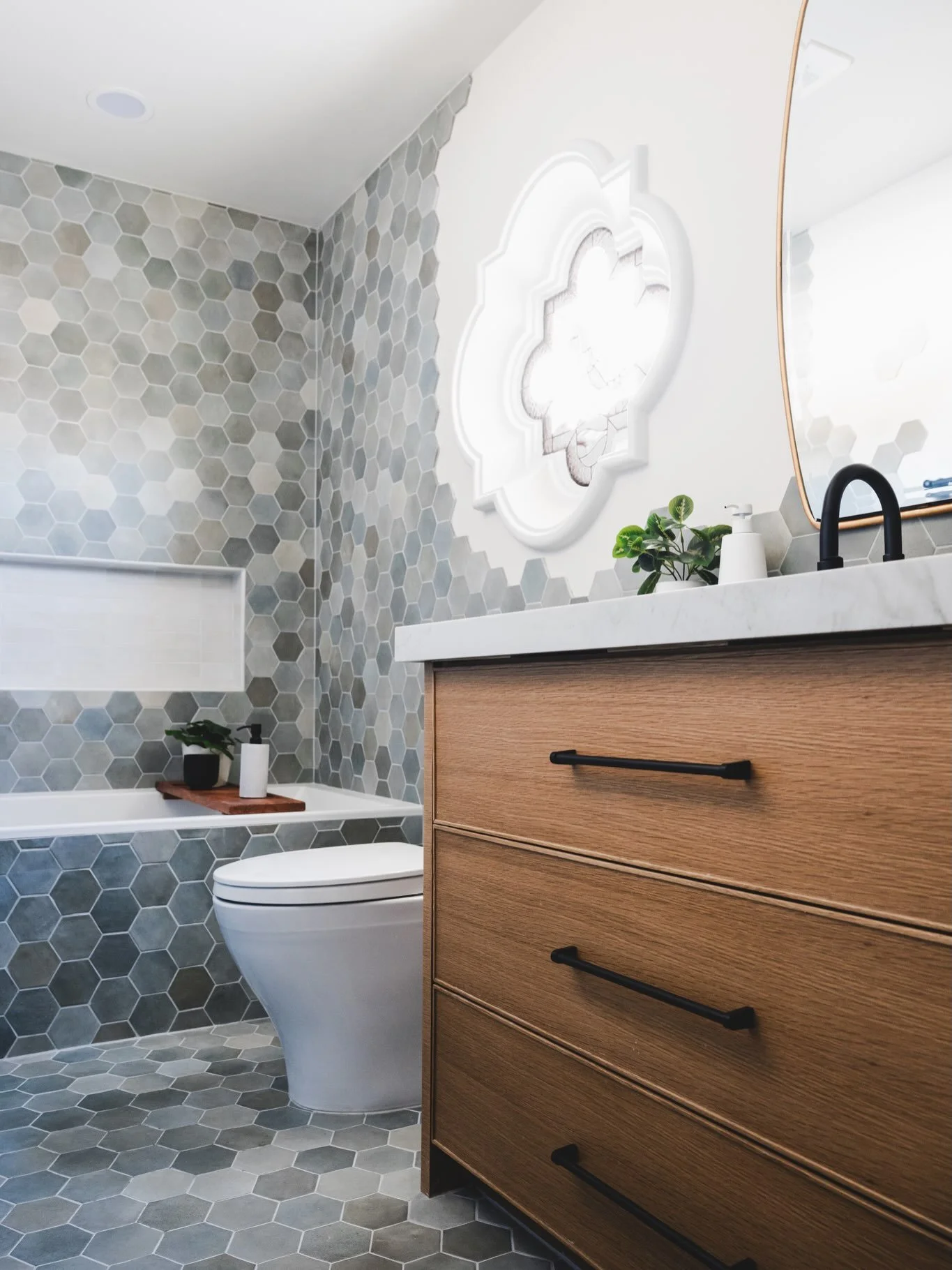 From rendering to reality. 🤍

This guest bathroom started as a 3D vision. Hex tile floors, a warm wood vanity, that statement window. Every detail of this space was chosen with our client before a single material was ordered.

Seeing it come to life
