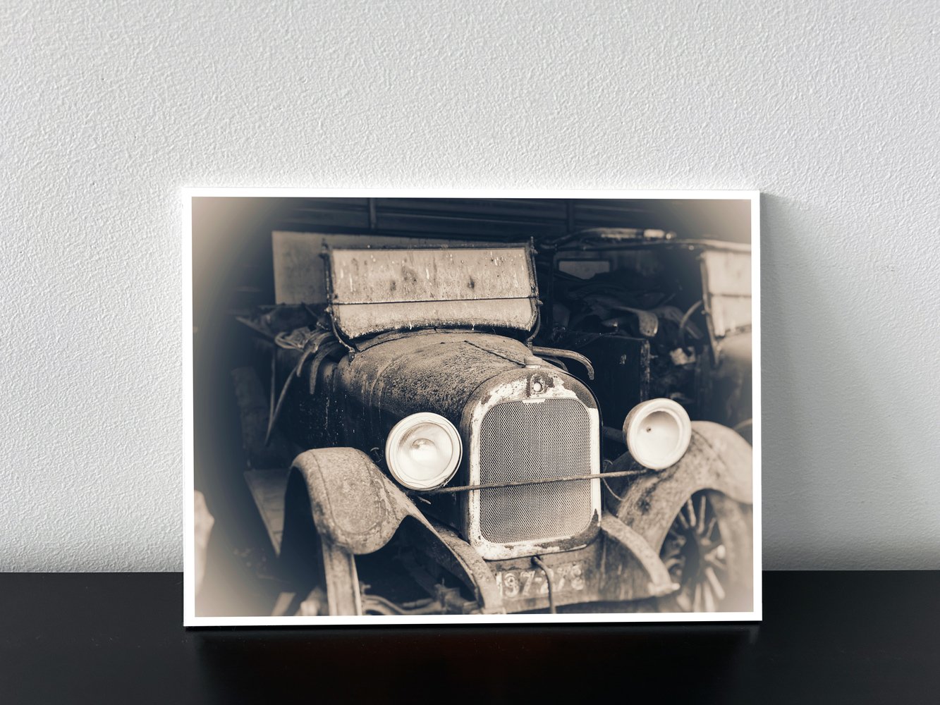 Sepia-toned photo of vintage 1922 Rugby Durant car with round headlights and exposed engine.