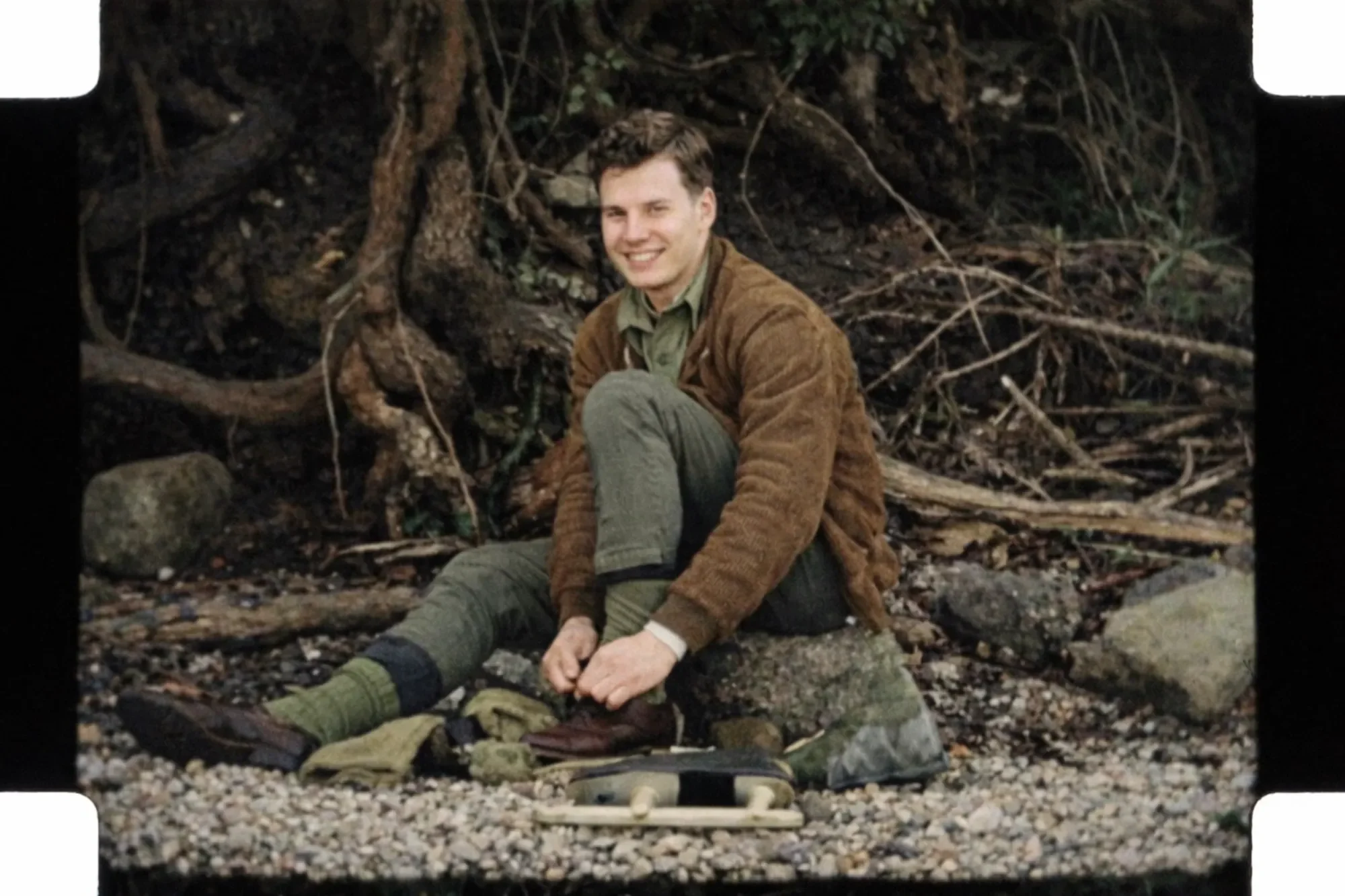 Jim Parmlee putting on ice skates, in color.