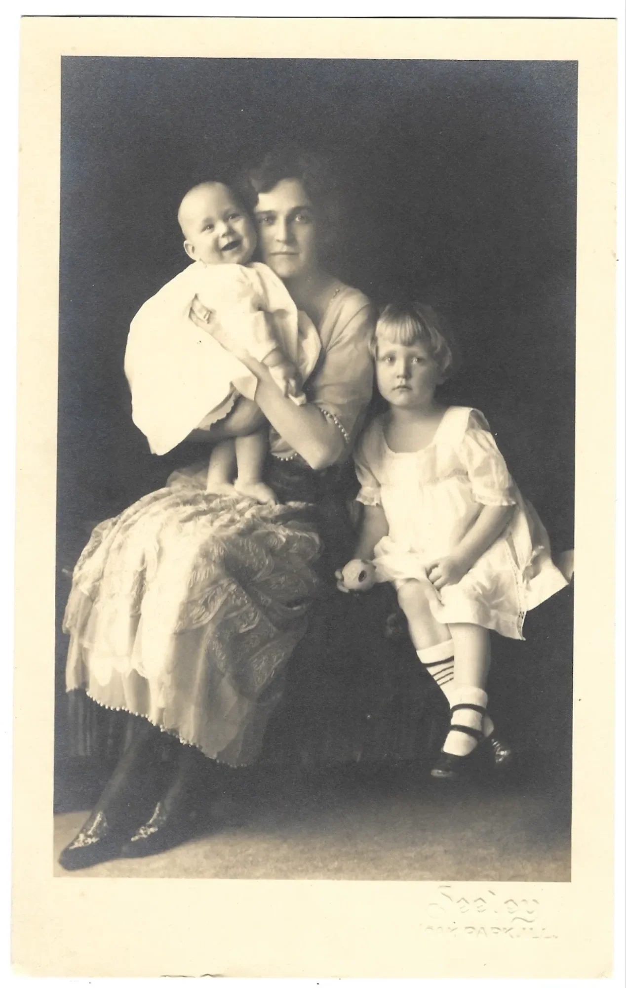 Helen Stein Johnson with her two young children, circa 1920.