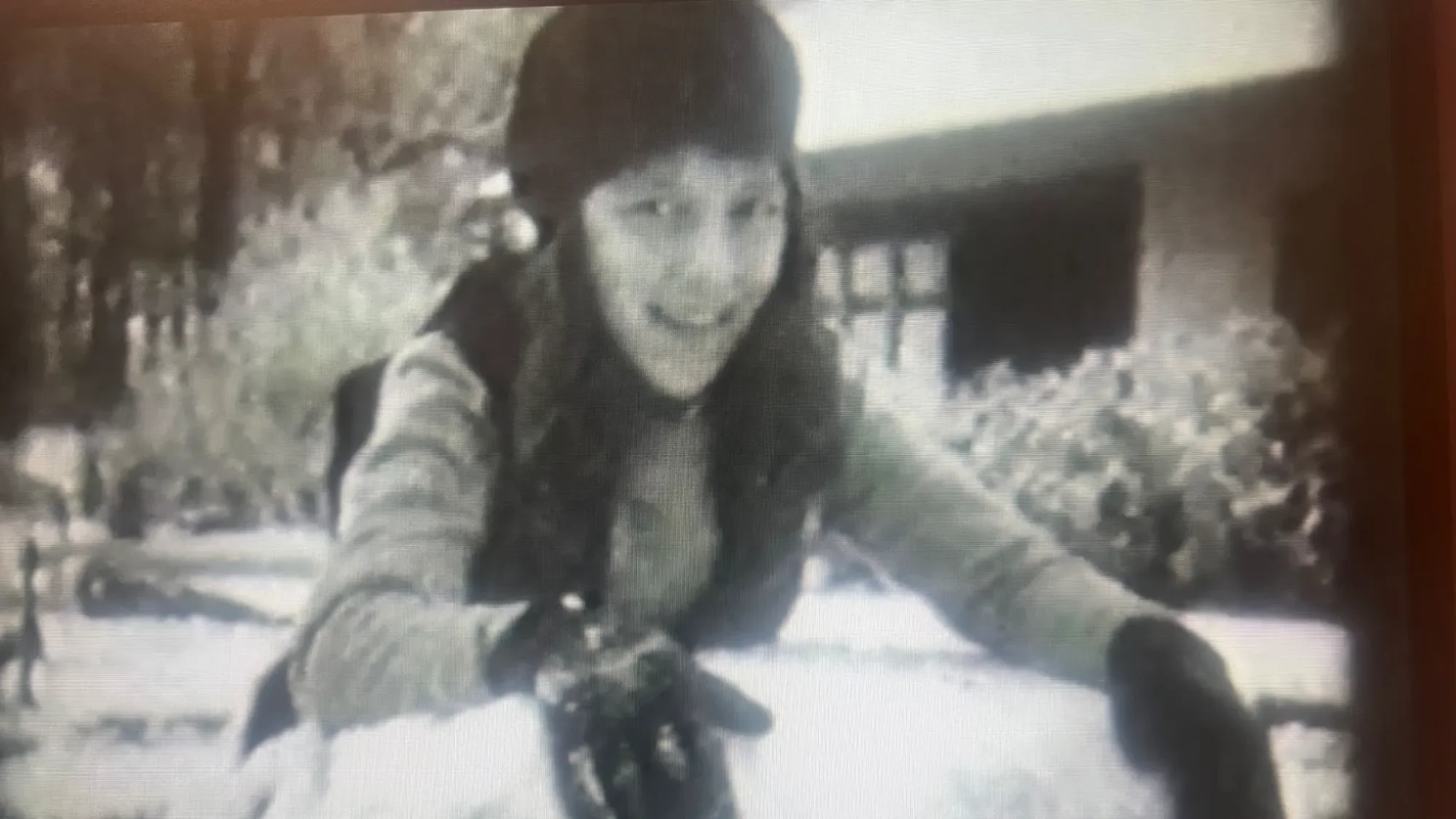 Marion Johnson playing in the snow.