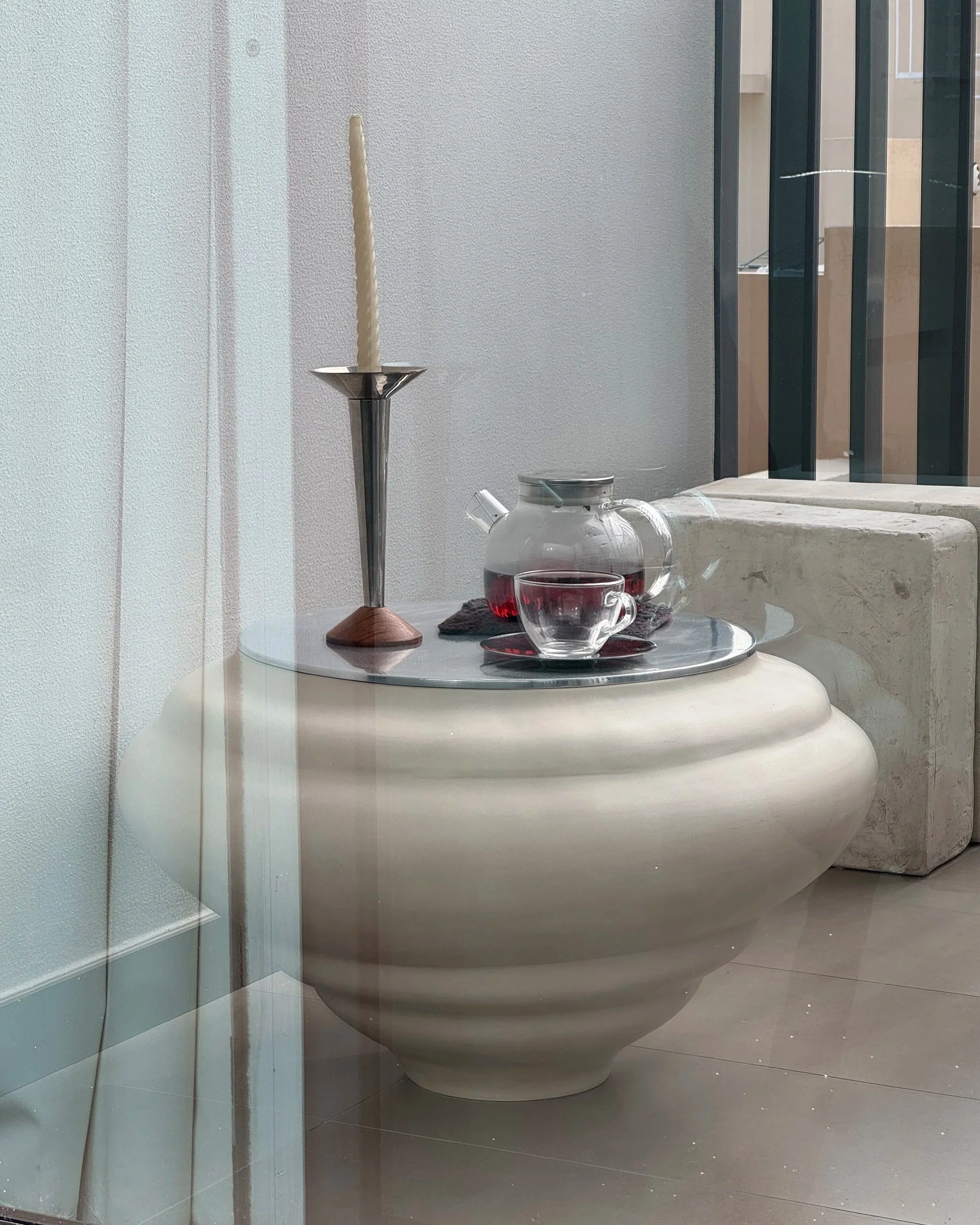 Ampla x Lume side table by SOIO Studio, styled on a balcony in Dubai