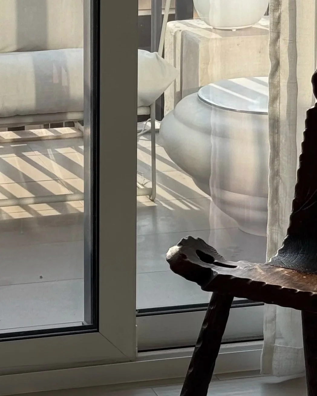 SOIO Studio Ampla x Lume stoneware / aluminum side table styled in an outdoor living space