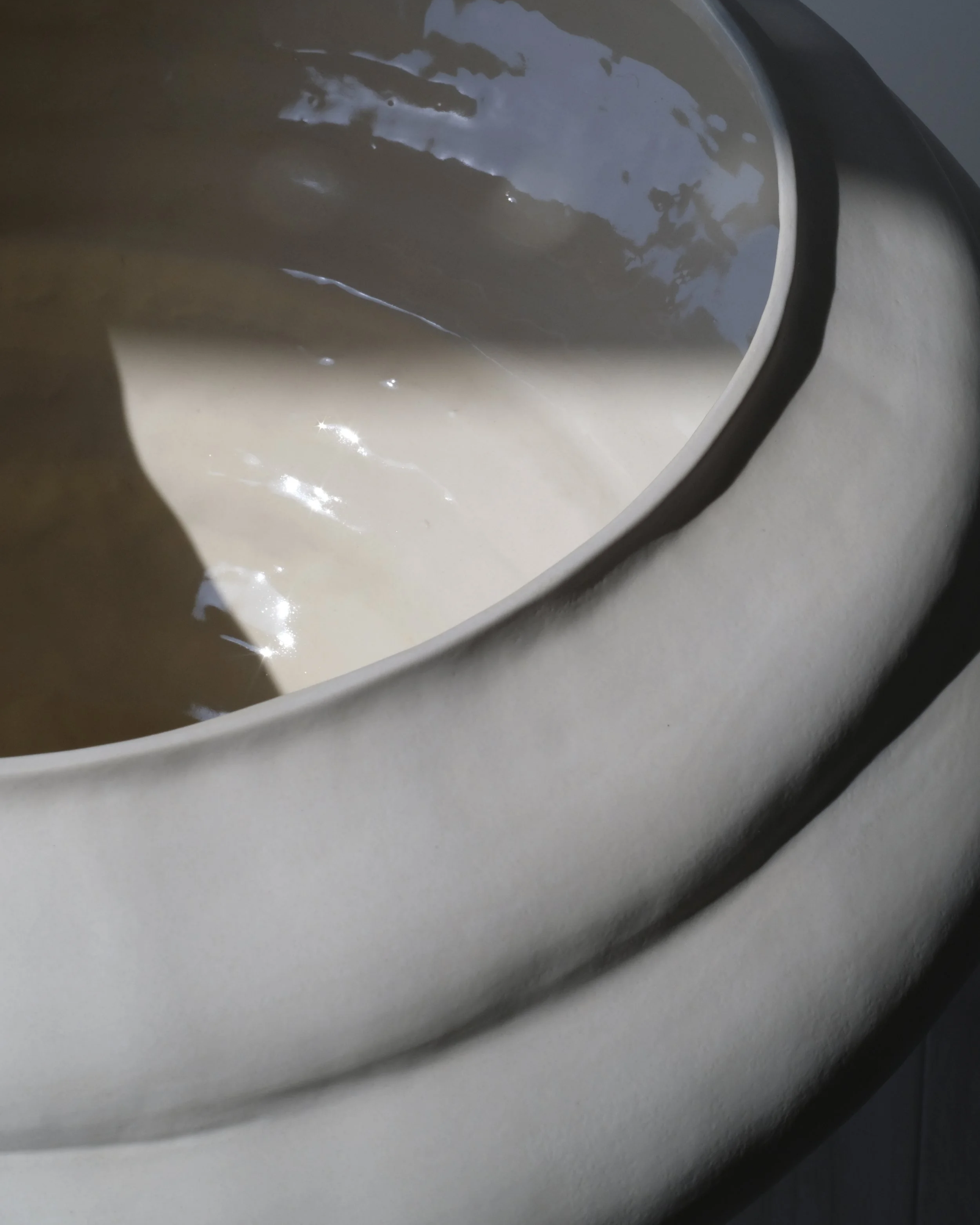 Detail of a hand-coiled Ampla stoneware piece by SOIO Studio