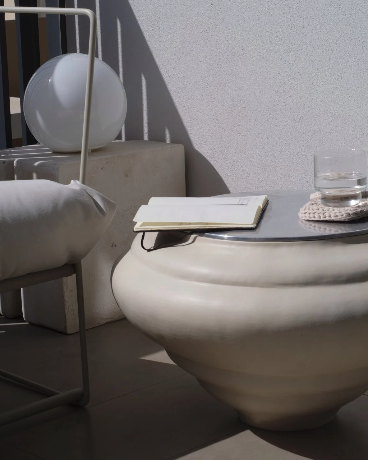 Ampla x Lume side table by SOIO Studio on a balcony, at home indoors and out