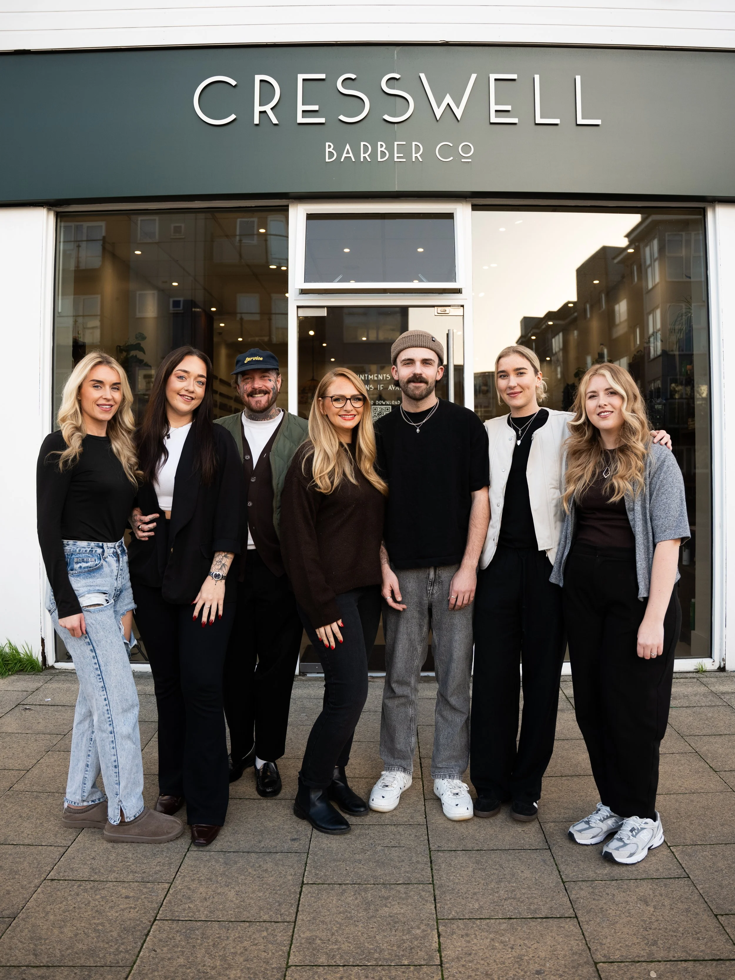 A team photo of Cresswell Barber in Shirley, Southampton, taken outside the barber shop