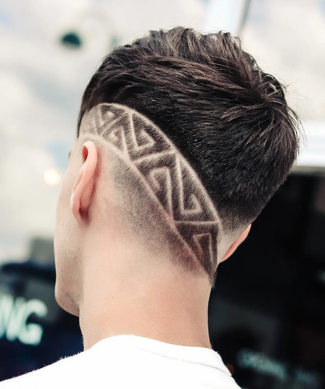 Guy with a pattern cut into his hair
