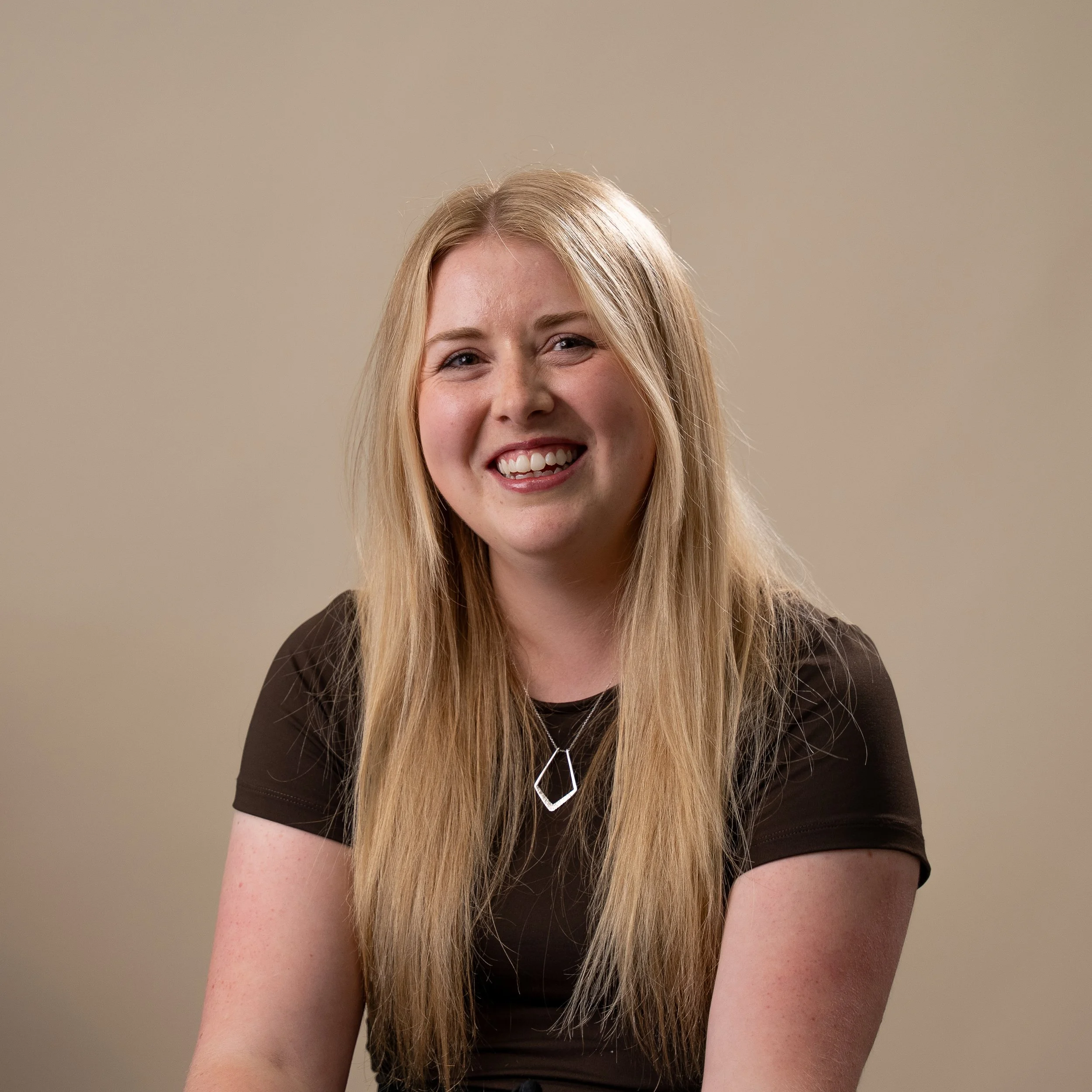 A photograph of Christine Mitchell, a barber at Cresswell Barber Co.