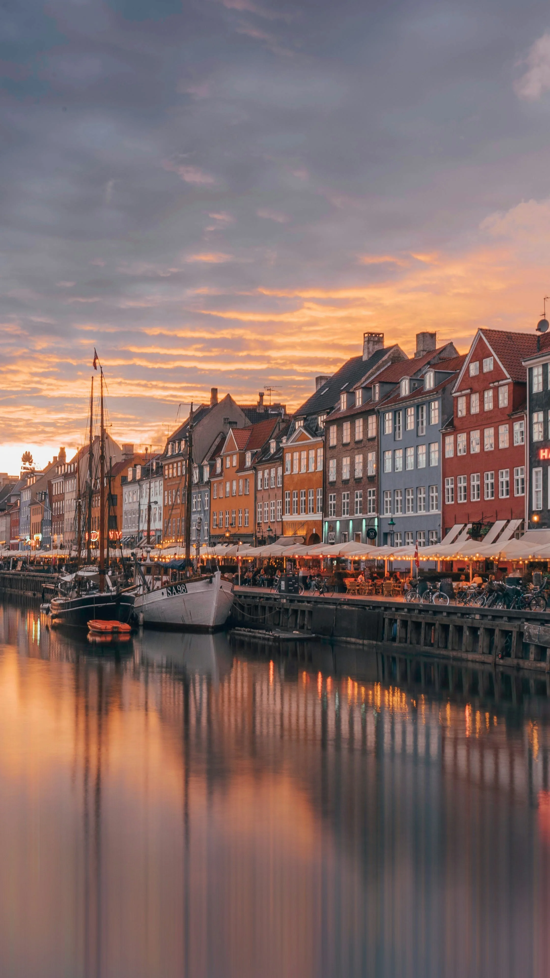 Nyhavn canal in Copenhagen at sunset.