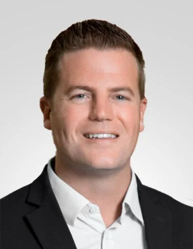 Smiling man in a suit in an office setting