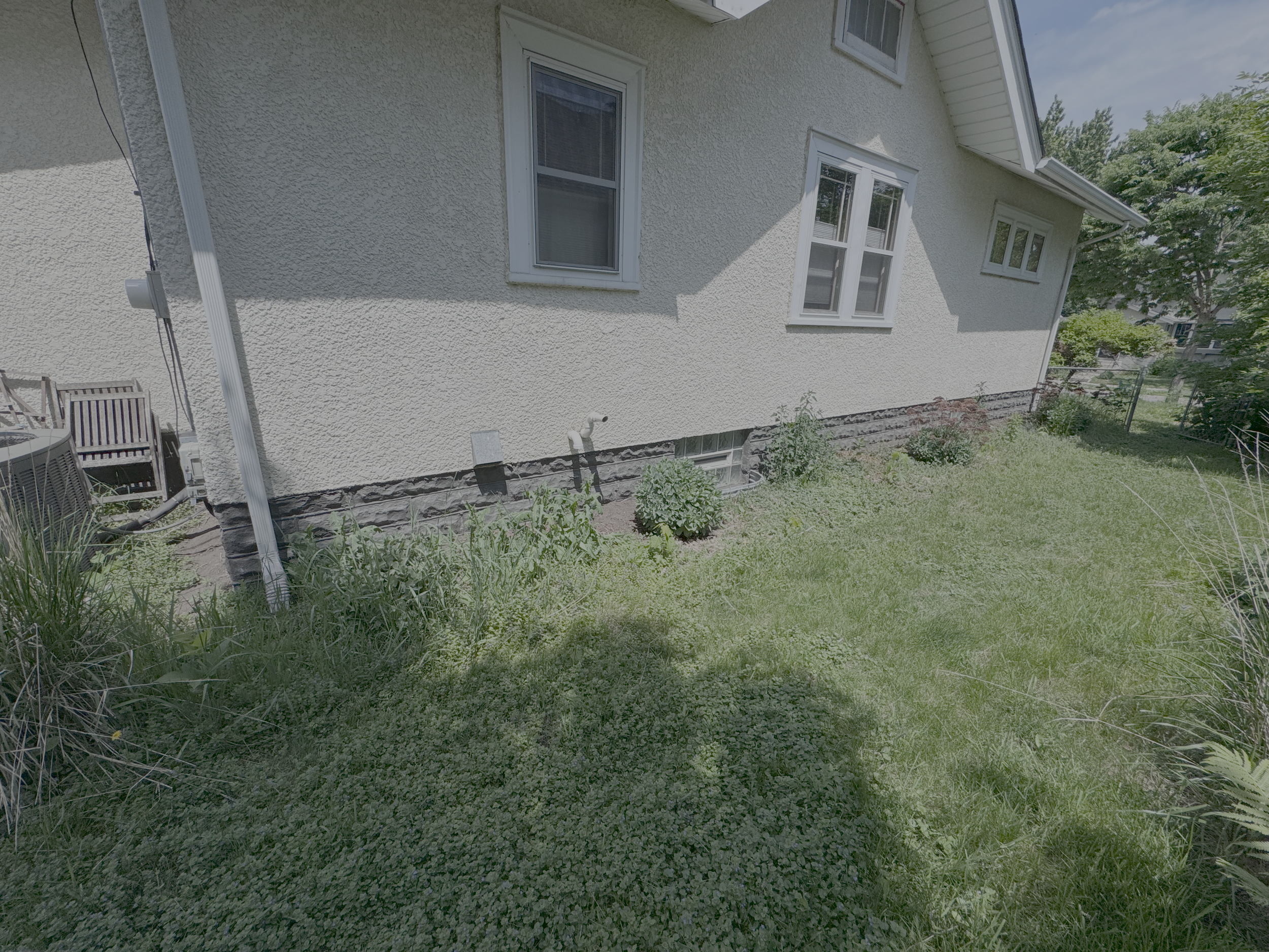 This yard had been landscaped at one point but had not been cared for in quite awhile. The sellers wanted a quick and easy transformation so that the outside matched the well-cared for inside. By relocating many plants throughout the yard, we were ab
