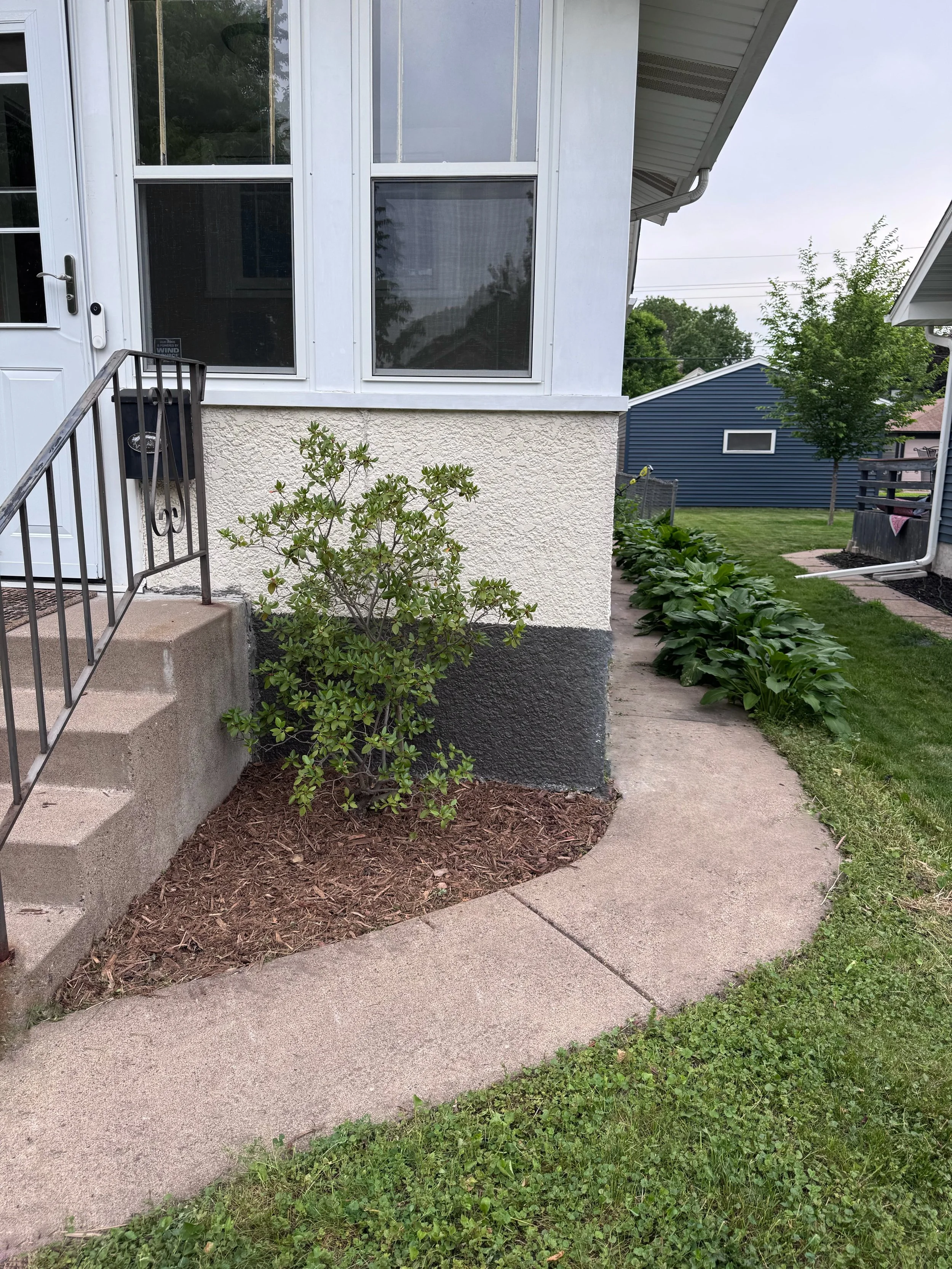This yard had been landscaped at one point but had not been cared for in quite awhile. The sellers wanted a quick and easy transformation so that the outside matched the well-cared for inside. By relocating many plants throughout the yard, we were ab