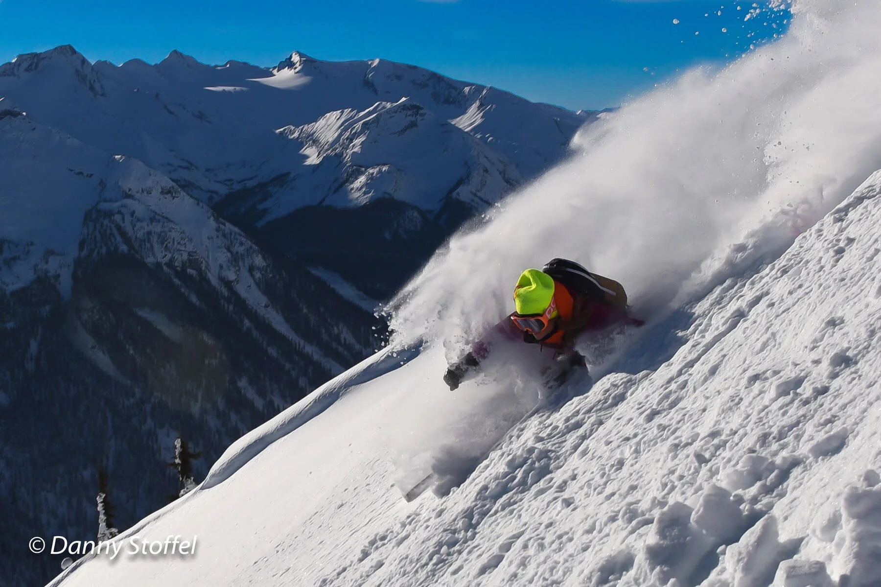 Lyndsay skiing deep powder on a sunny day