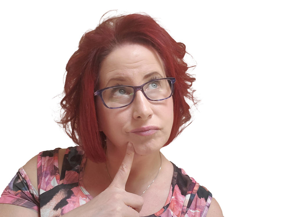 A woman with red hair and glasses looking upwards with her finger on her chin, seemingly in thought.