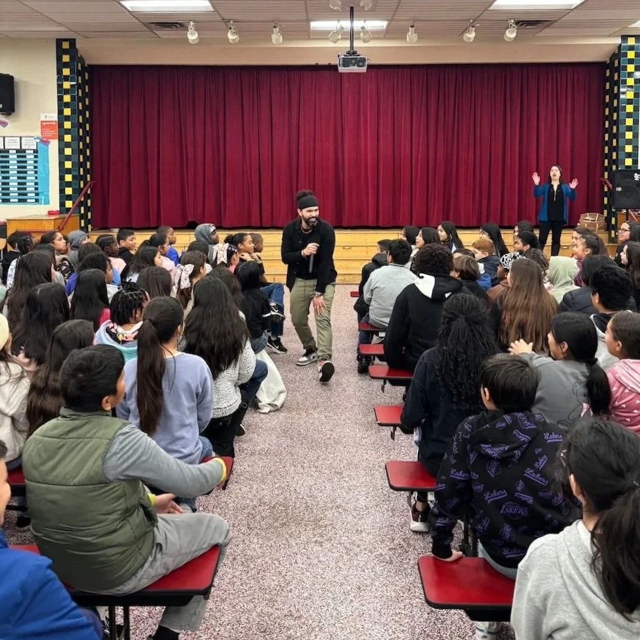 Talking Peace Collective - Jeo Ramos speaking and rapping to middle school and high school in a dynamic assembly.