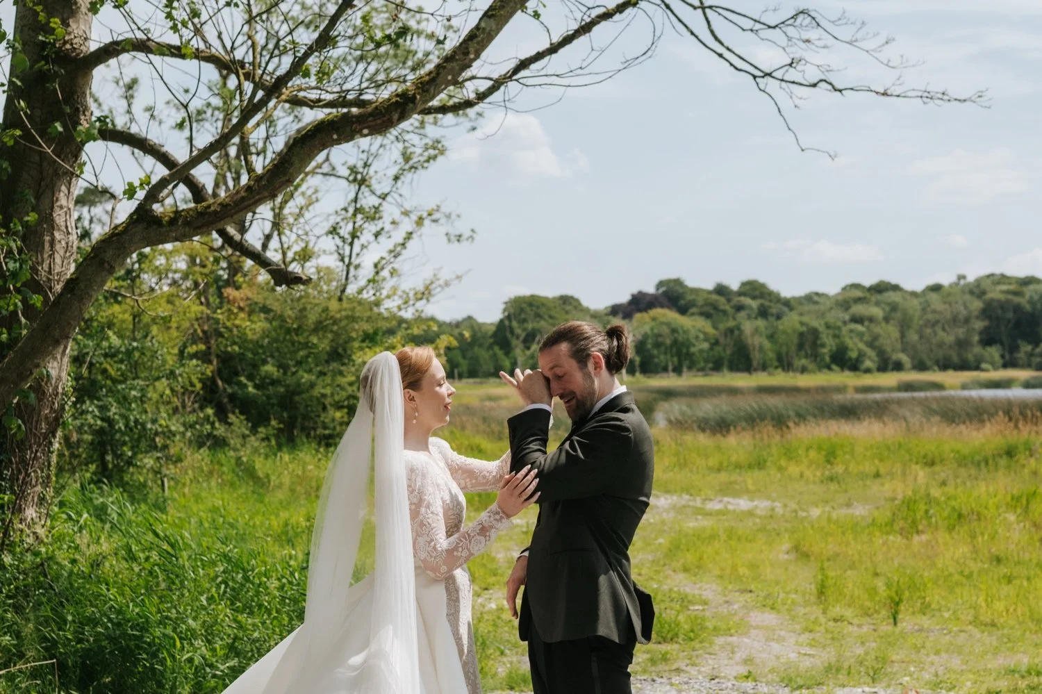 Bride and groom first look by lake at Ashley Park House Tipperary