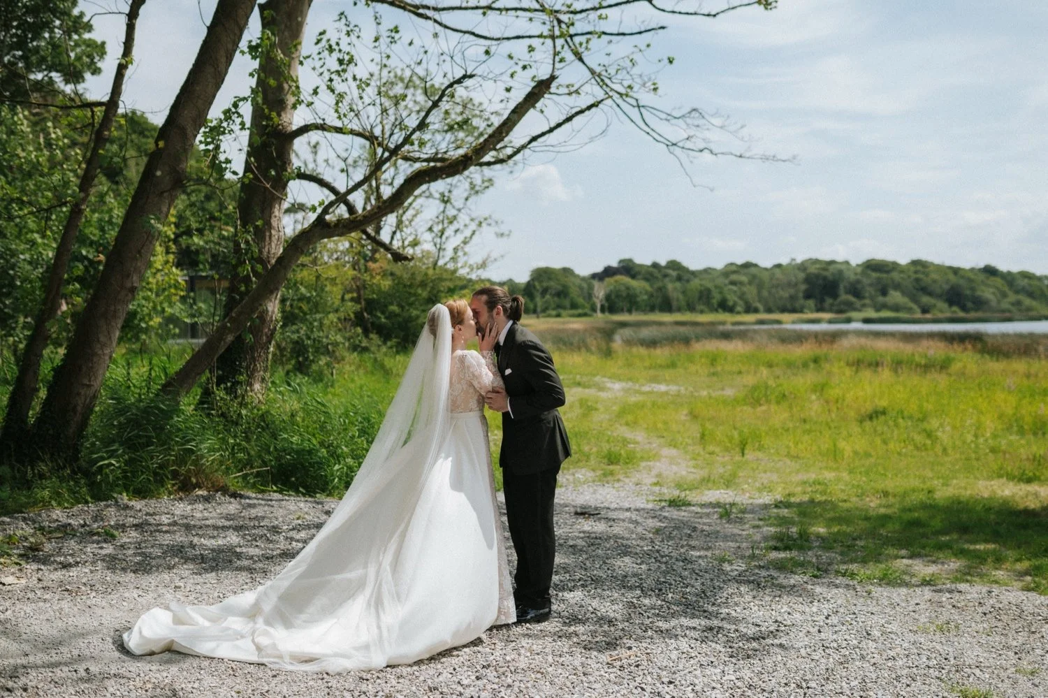 Bride and groom first look by lake at Ashley Park House Tipperary