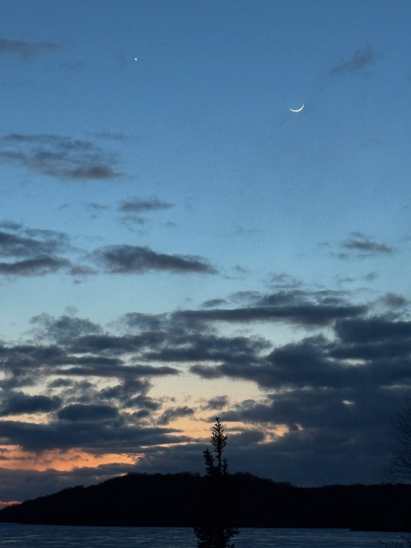 The crescent moon over Lake Michigamme tonight. #lakemichigamme #crescentmoon #yooperlife