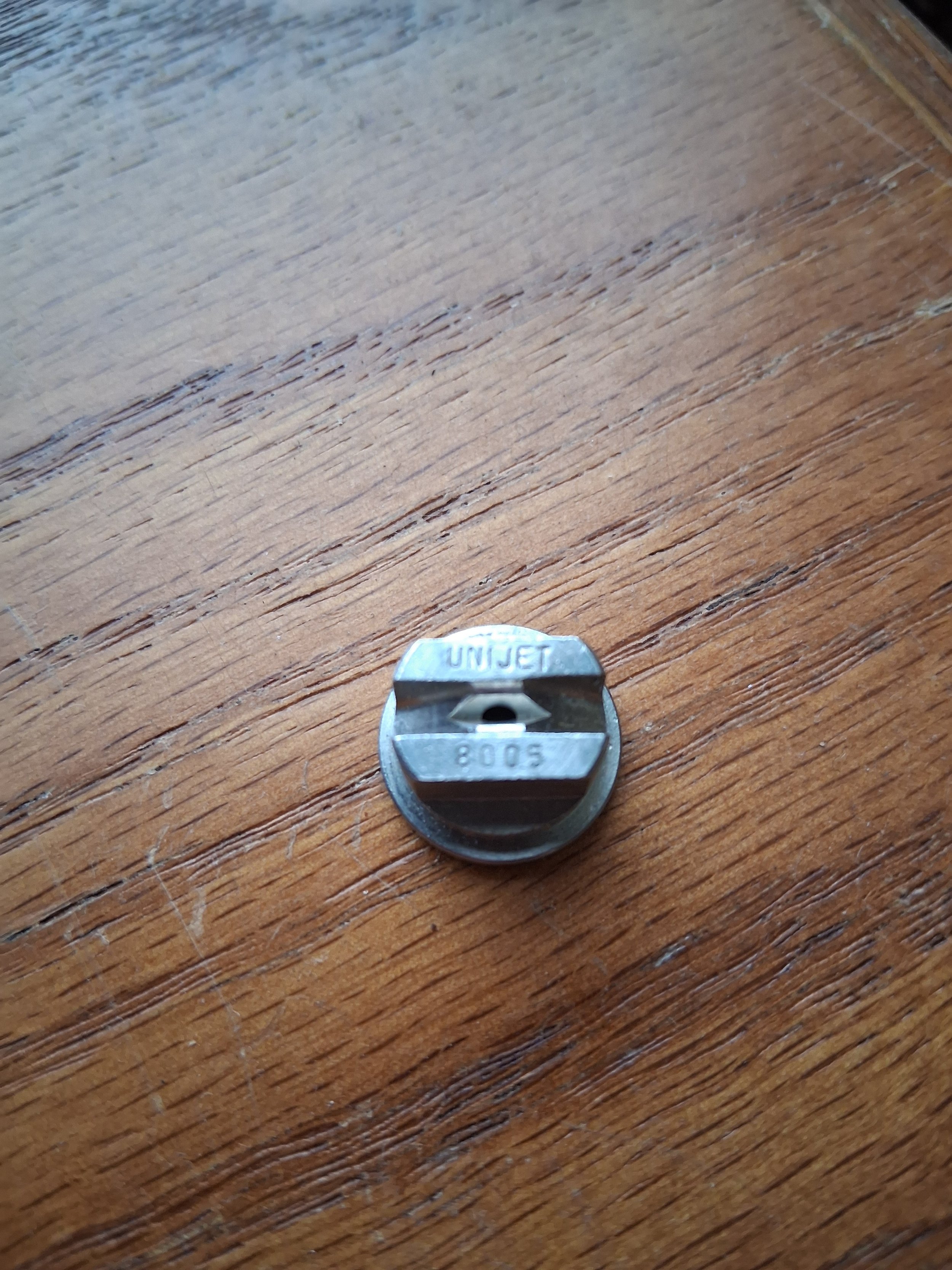 Stainless steel 8004 and 8005 TeeJet nozzle tips for carpet cleaning wands, 80-degree flat fan spray pattern.