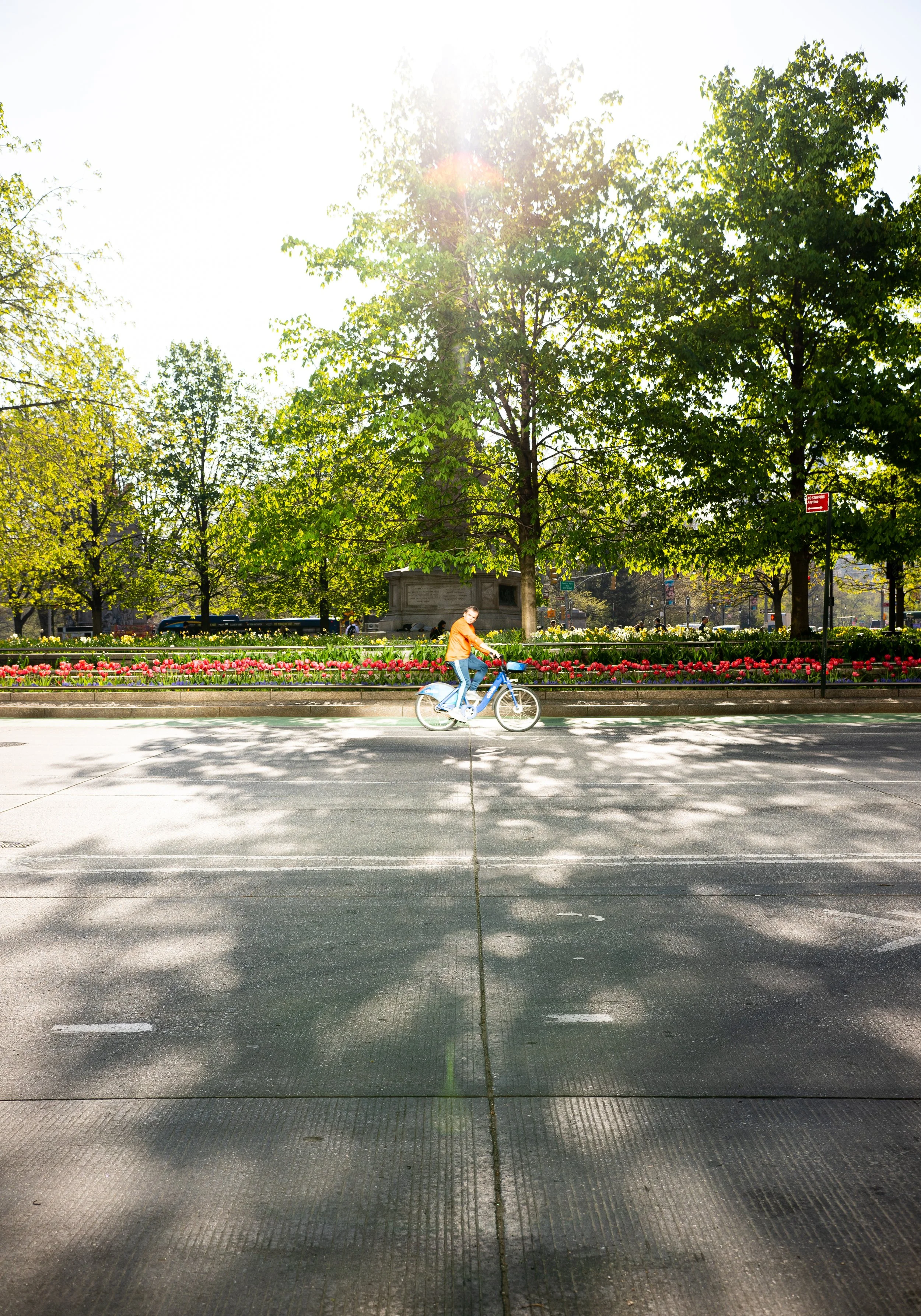 A biker looks out at the road on a spring morning in Columbus Circle, New York City May 2026.