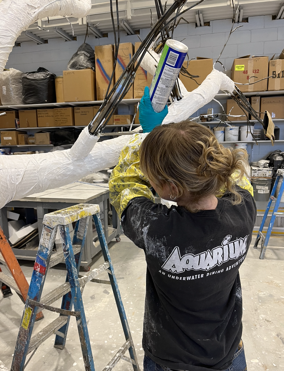 La Boheme - using spray foam to build up tree branches.