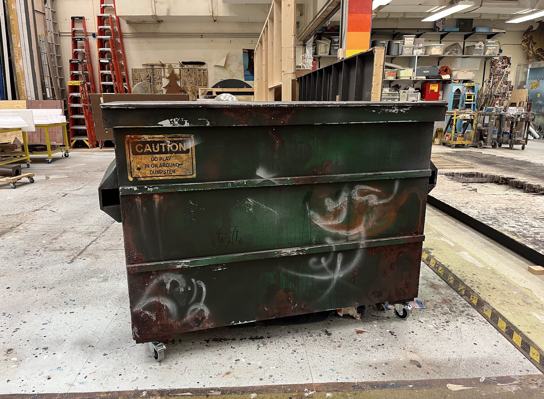 Wood painted to metal dumpster for Rent at the University of Michigan 2023.
