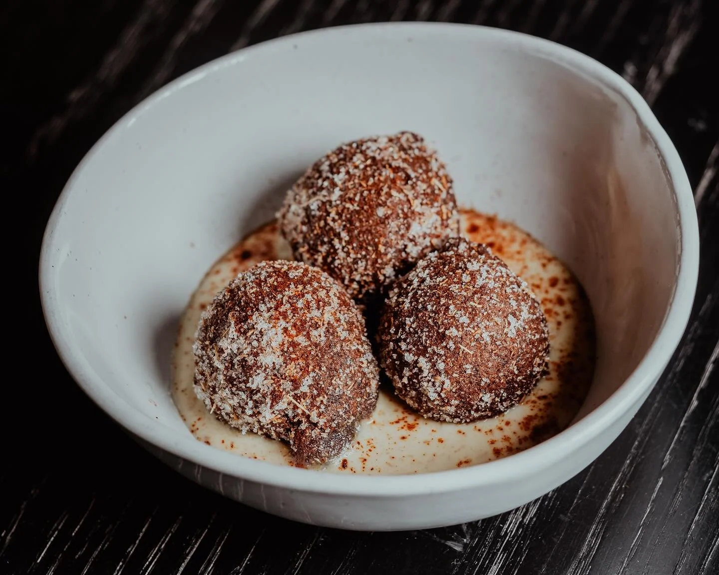 Not all Halloween treats need to come in a plastic wrapper this week.  Satisfy your sweet tooth with a nightcap and a returning fan-favorite from our dessert menu. 
Our ‘Grown Up Cocoa Puffs’ are crispy-hot, chocolate fritters dusted in