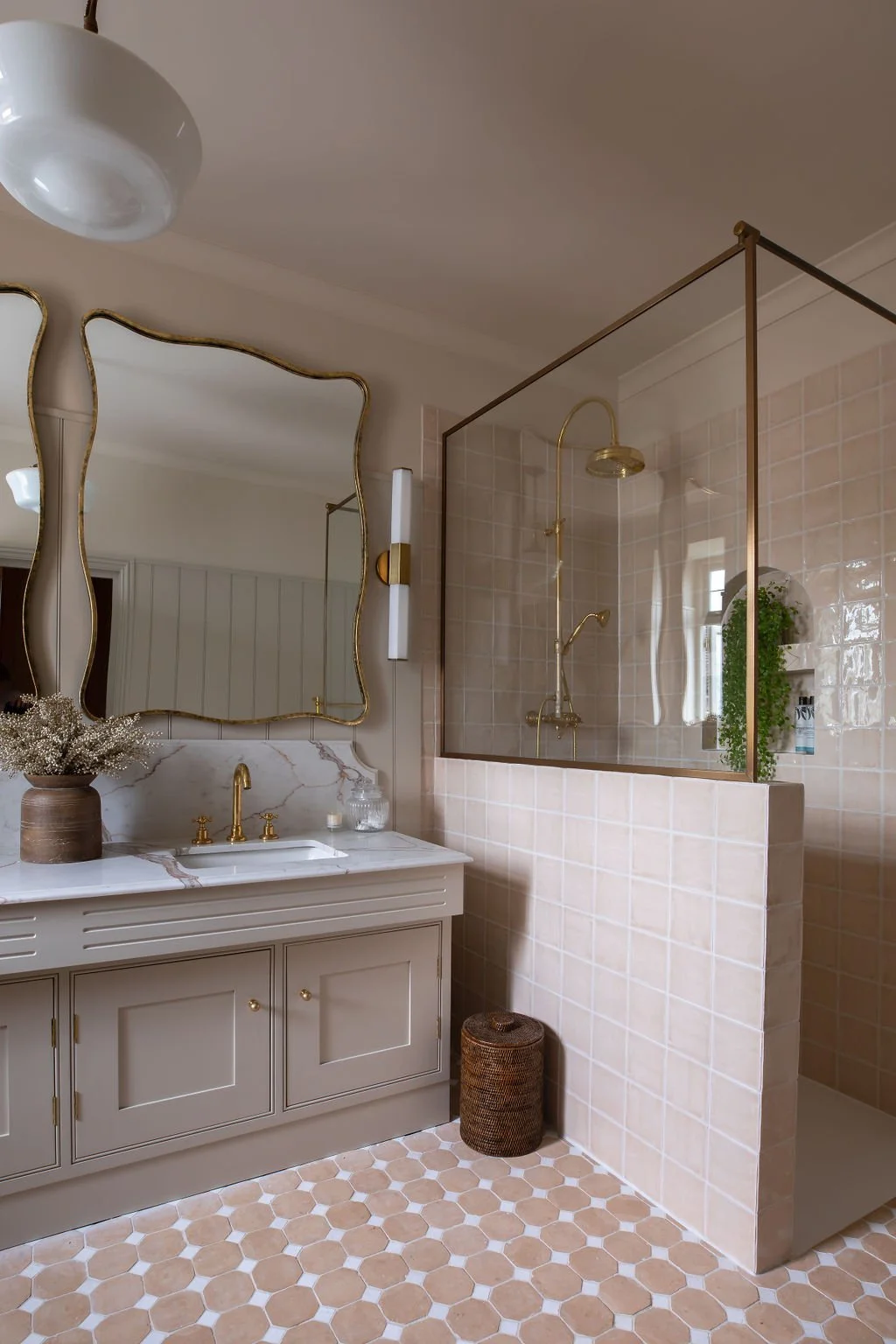 Pink bathroom with brass