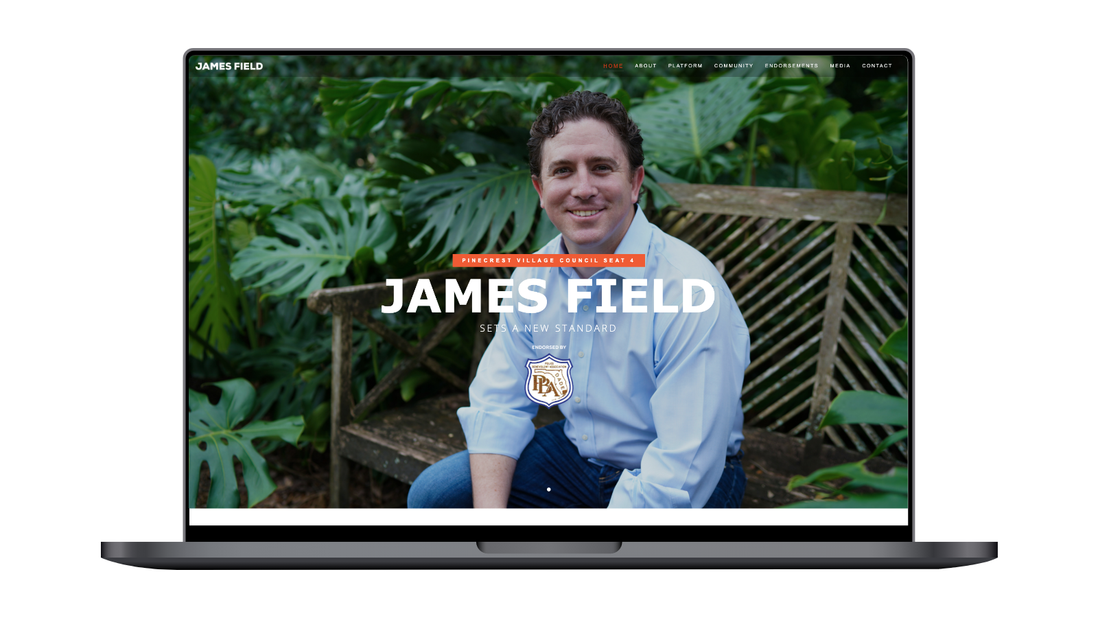 Laptop displaying a website for a candidate named James Field, running for Pinecrest Village Council Seat 4, with text 'Sets a New Standard' and greenery in the background.