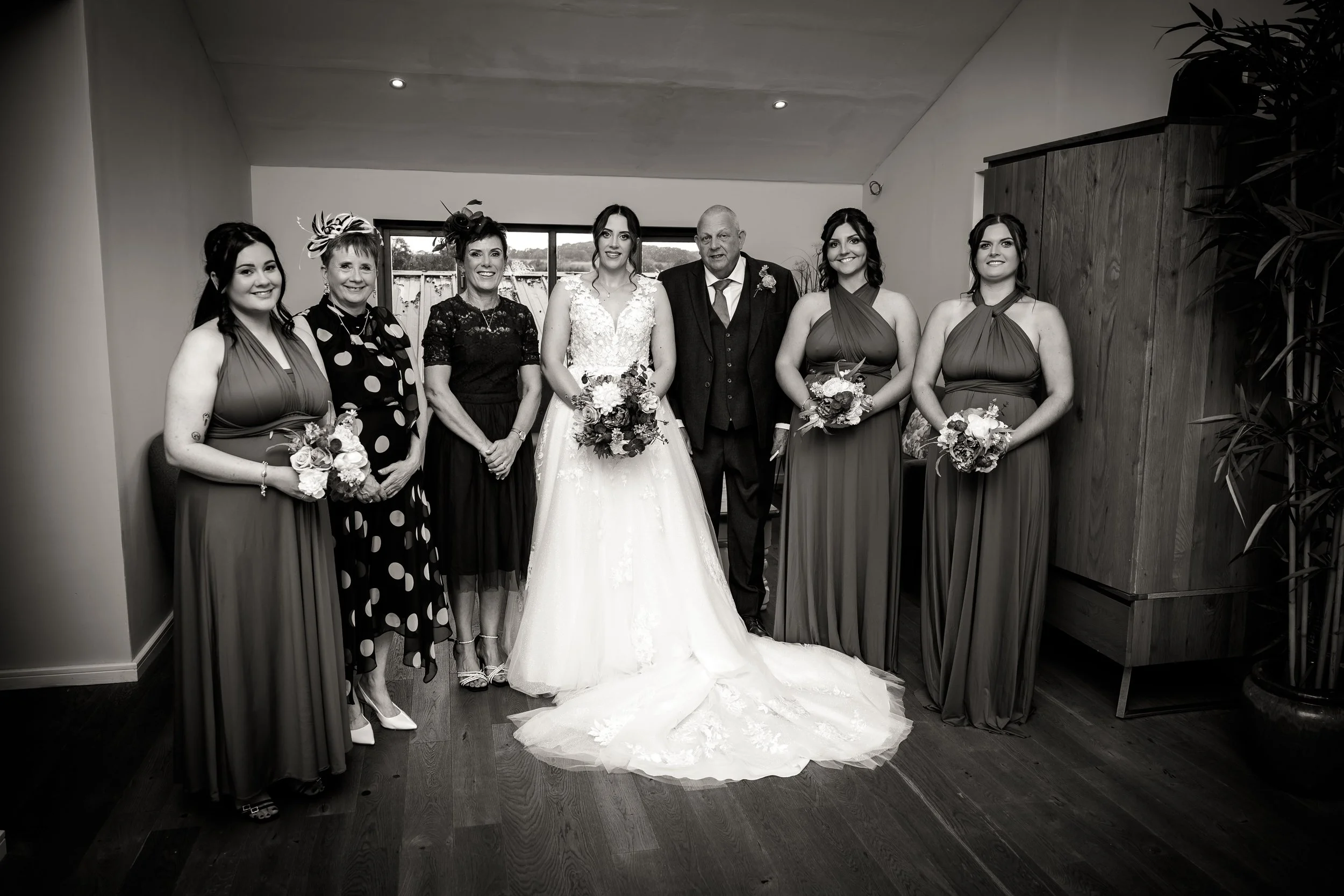 Bride and bridesmaids finishing preparation's