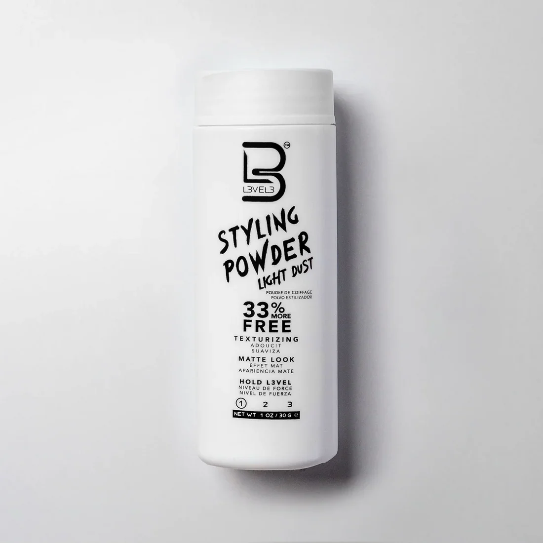 White container of styling powder labeled 'Light Dust' with 33% more free, matte look, texturizing, and hold level 1 in black text.