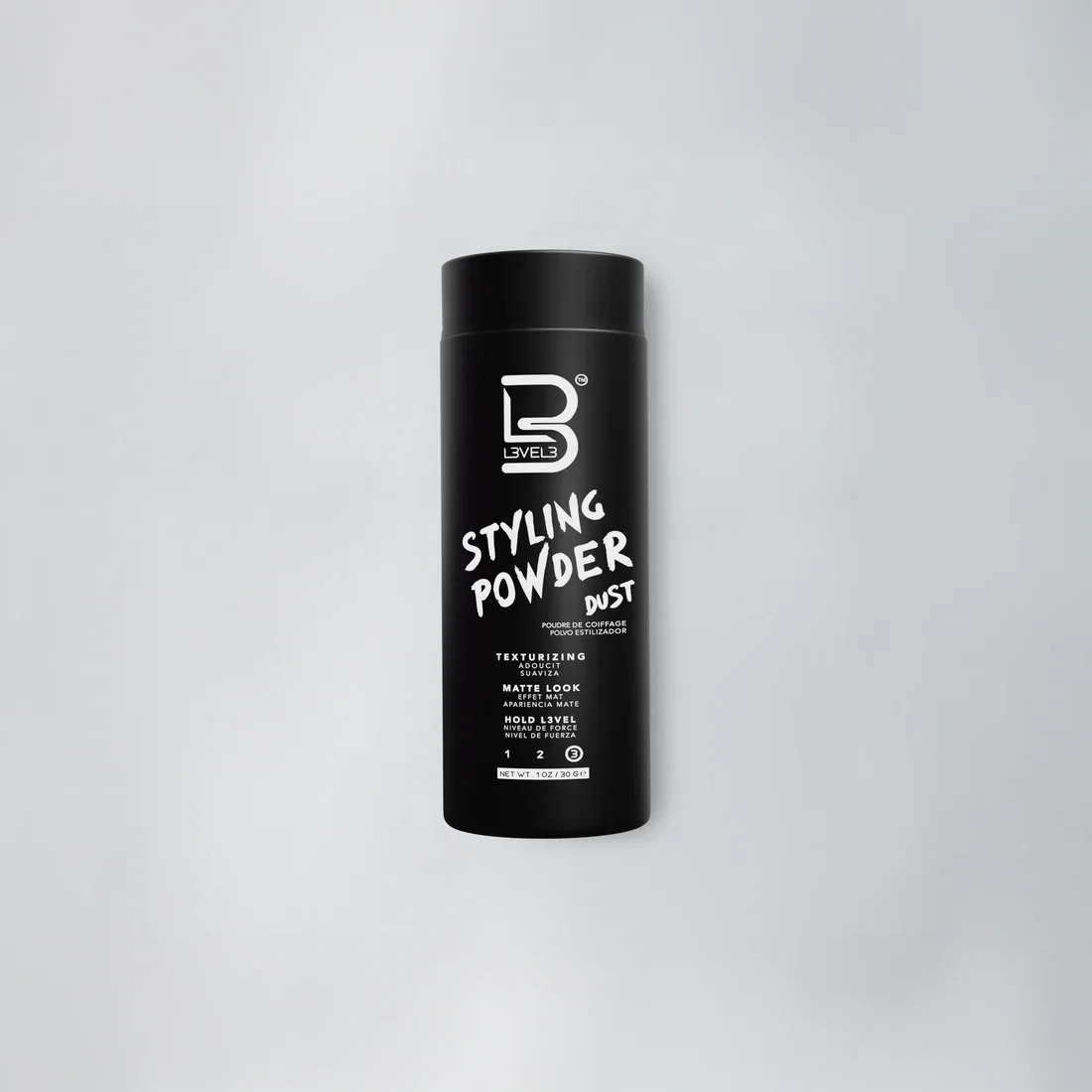 Black can of L3V3L 3 Styling Powder Dust for textured, matte look, with white text and logo on a gray background.