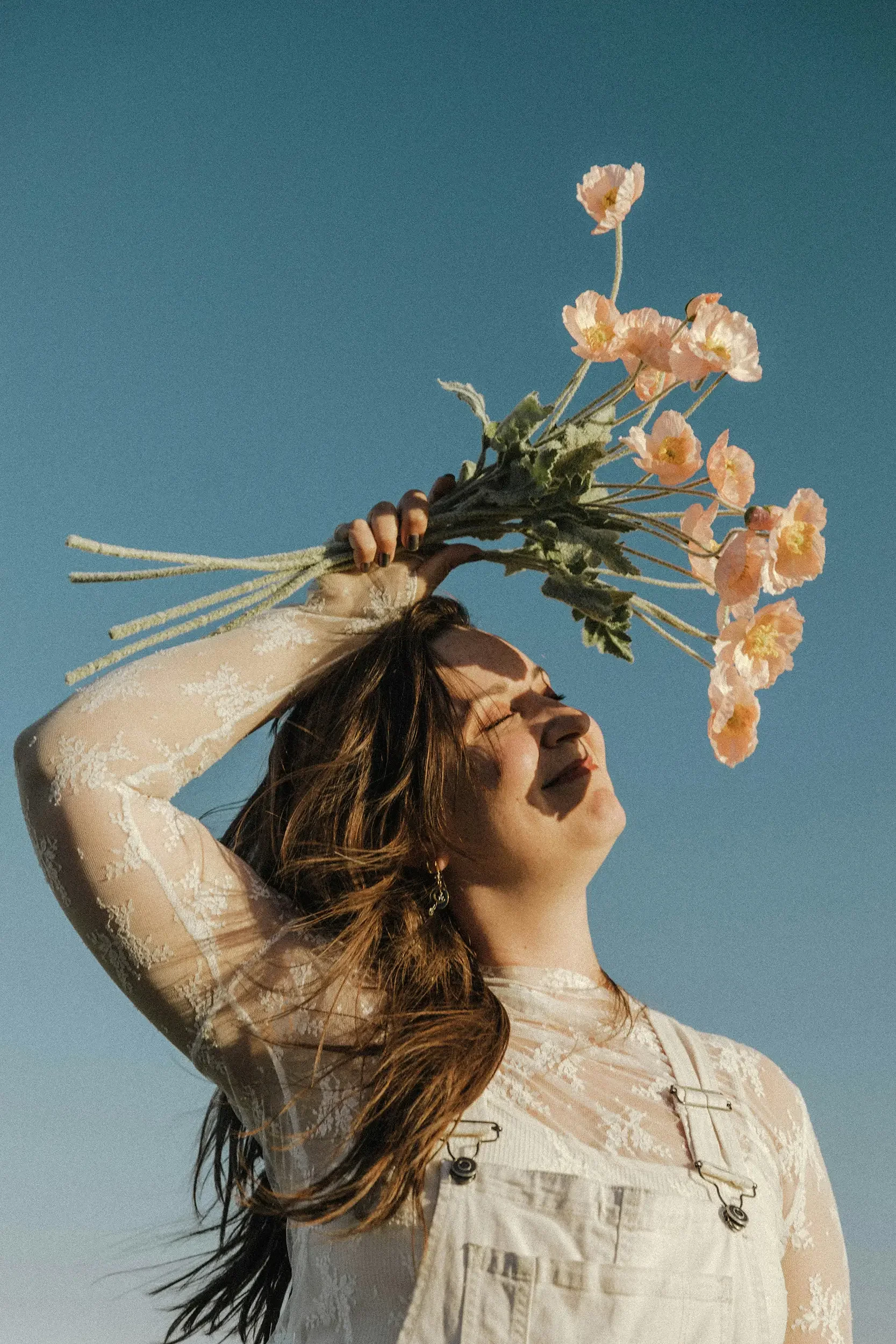 Woman holding flowers representing perimenopause and menopause
