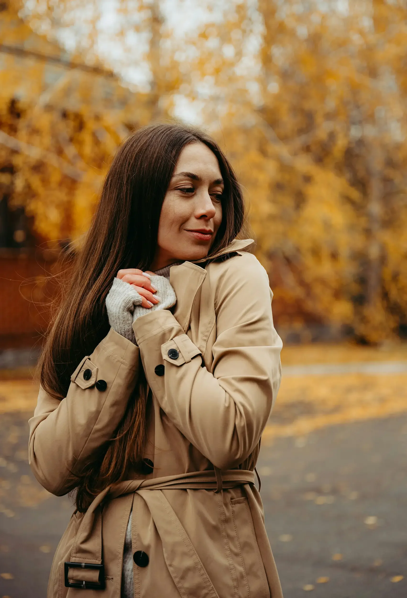 Woman walking in the fall in Plymouth, MI after therapy with Your Path Through Counseling