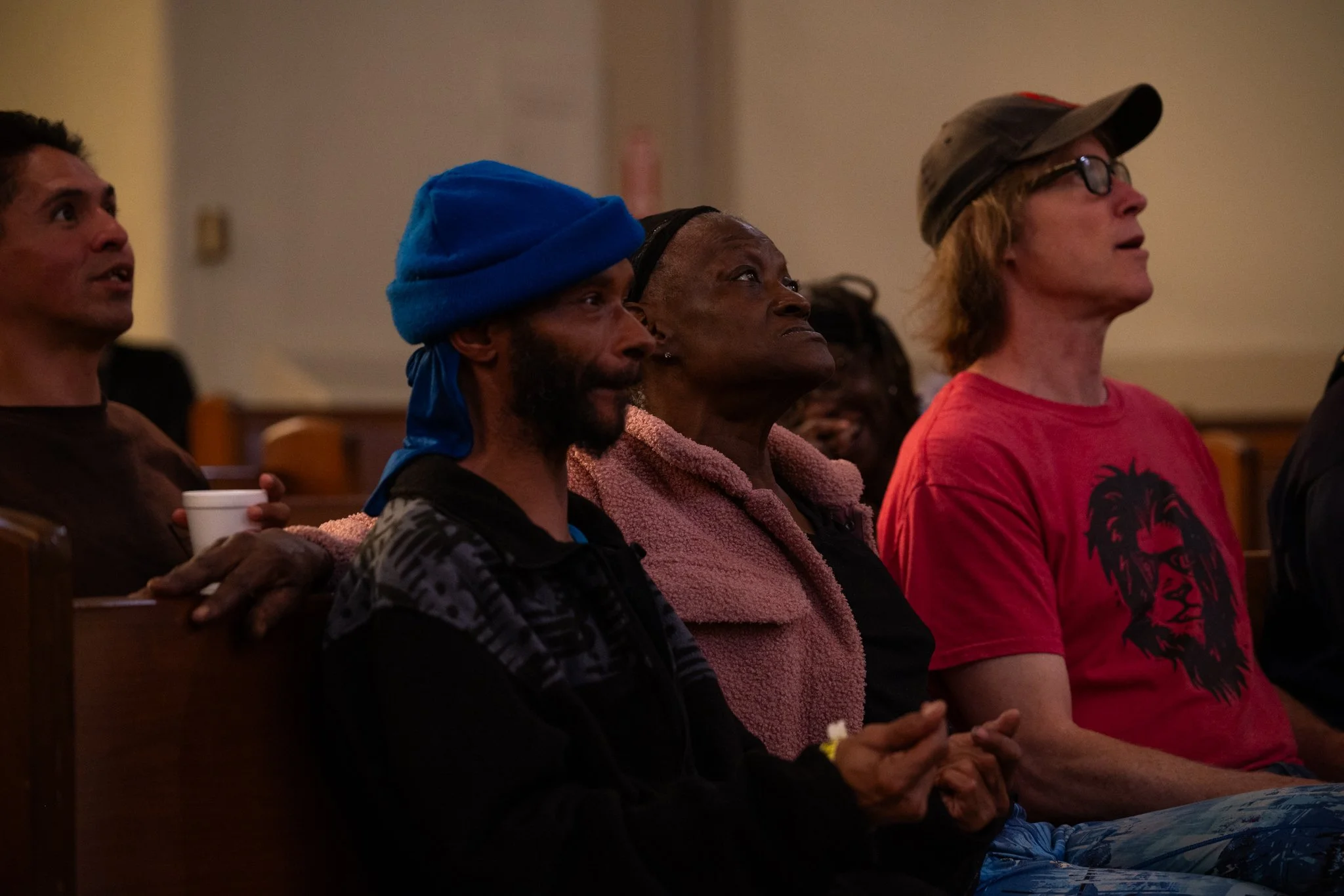 Members of the Recovery Cafe Muncie watch a performance in the sanctuary of the building April 4 in Muncie, Indiana