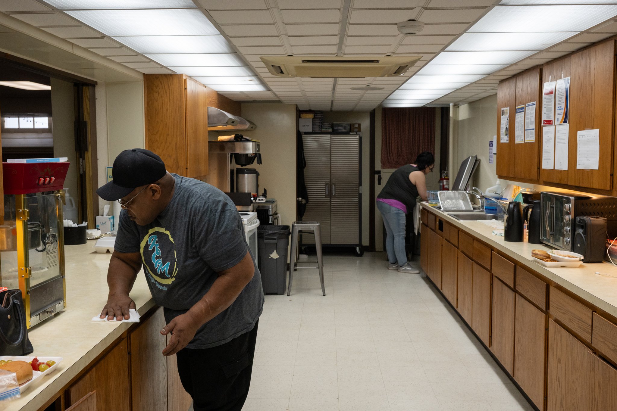 Volunteers for the Recovery Cafe Muncie clean after serving a meal during a gathering at the cafe April 4 in Muncie, Indiana. The cafe offers hot meals to members as well as a food drive open on Saturdays