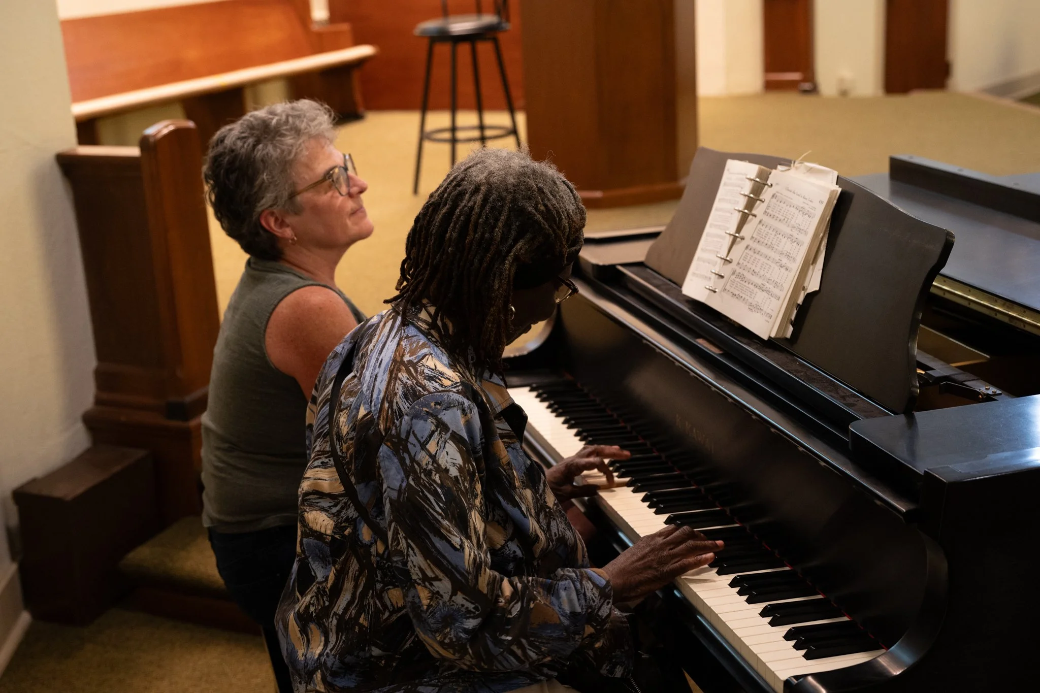  Recovery Cafe Muncie board member Linda Daniel, far, plays piano with Rosa Price, a member of the cafe April 11 in Muncie, Indiana