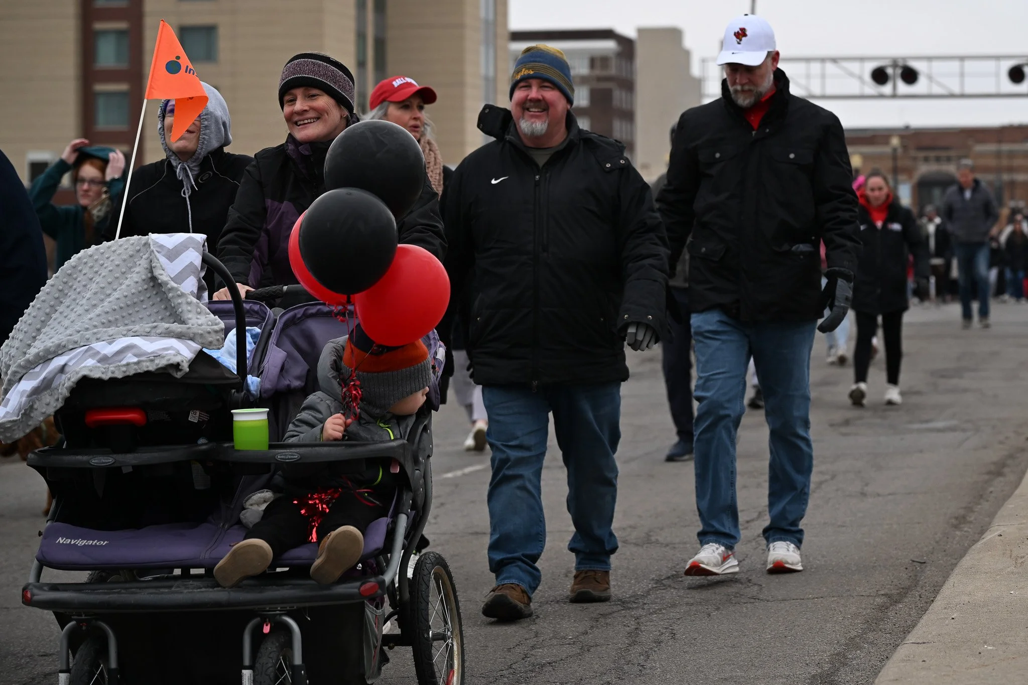 Attendees of Muncie Mission's Walk a Mile in My Shoes event walking down Walnut Street Feb. 21 in Muncie, Indiana. Ryan Fleek, DN