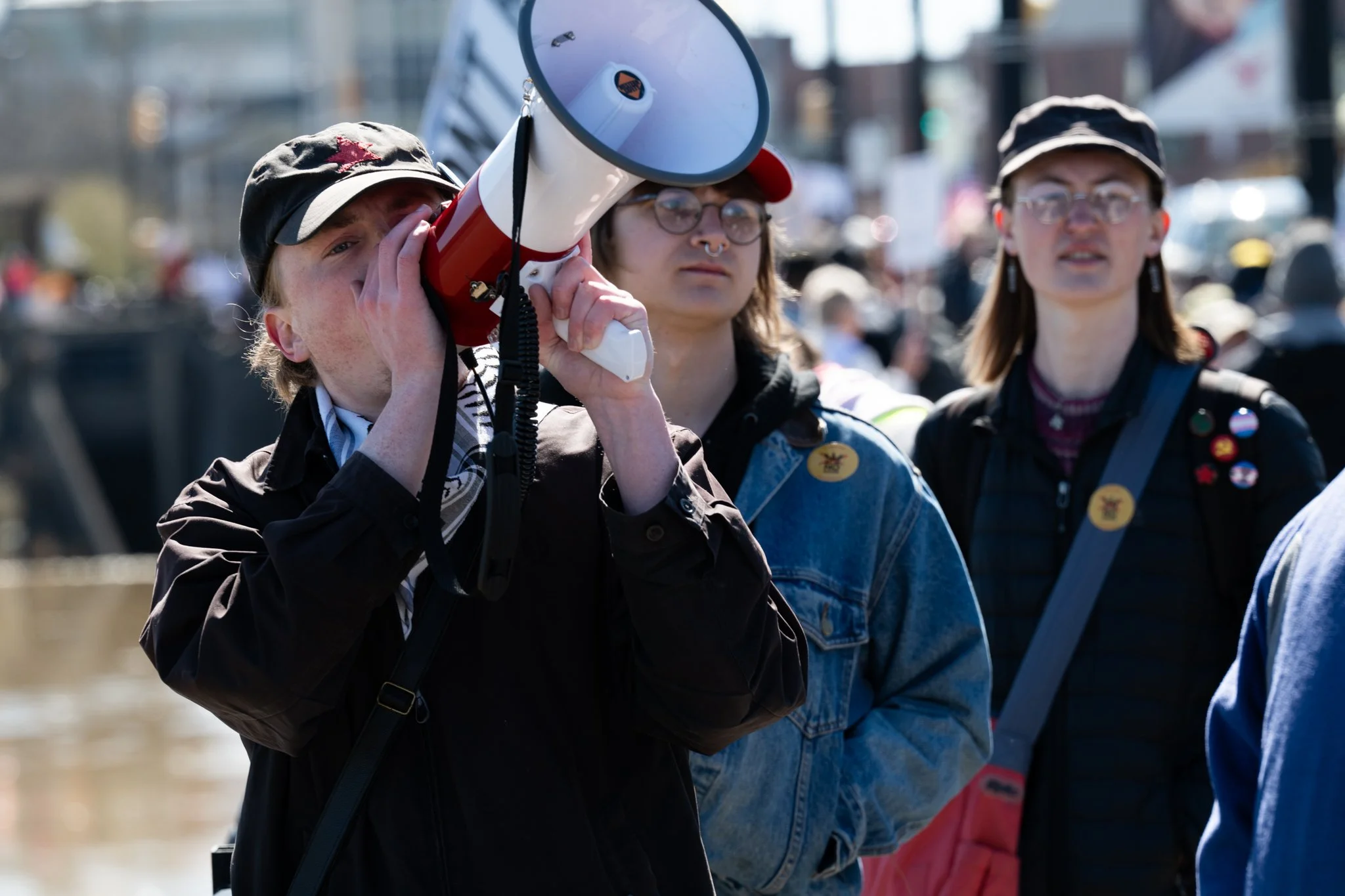 Ball State student Cooper Archer speaks into a megaphone during the ‘No Kings 3’ protest March 28 at the Fallen Heroes Memorial Bridge.