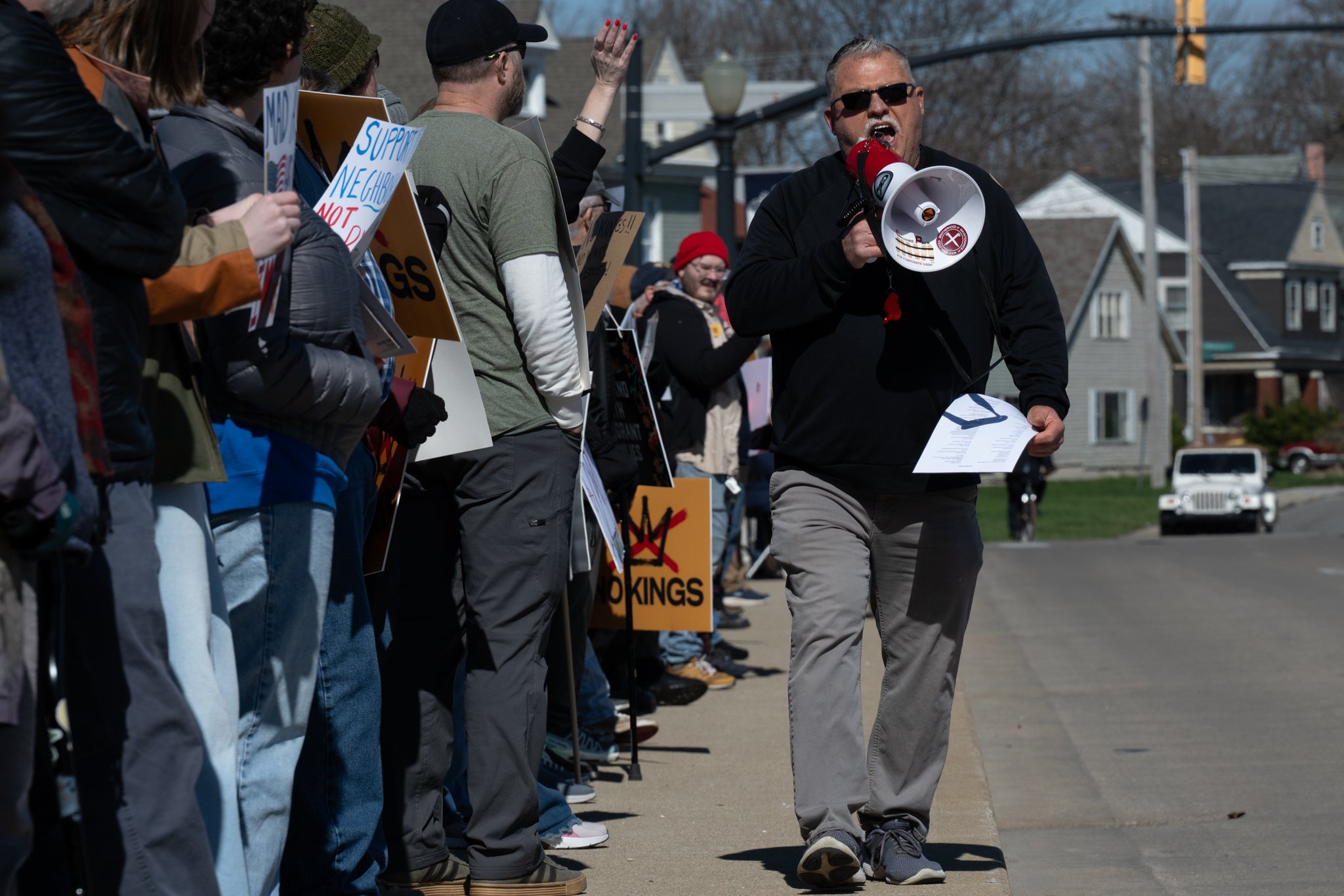 A protester chants into a megaphone during the ‘No Kings 3’ protest March 28 at the Fallen Heroes Memorial Bridge.