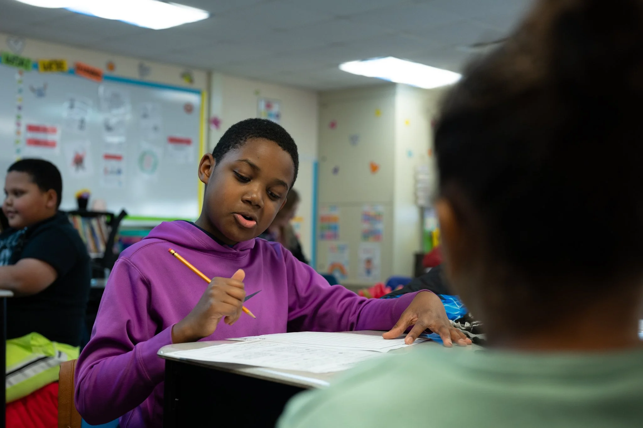 Fifth grade student Andrew Jones works on an assignment during Longfellow Elementary's after-school "XSTREAM" program Jan. 23 at Longfellow Elementary.