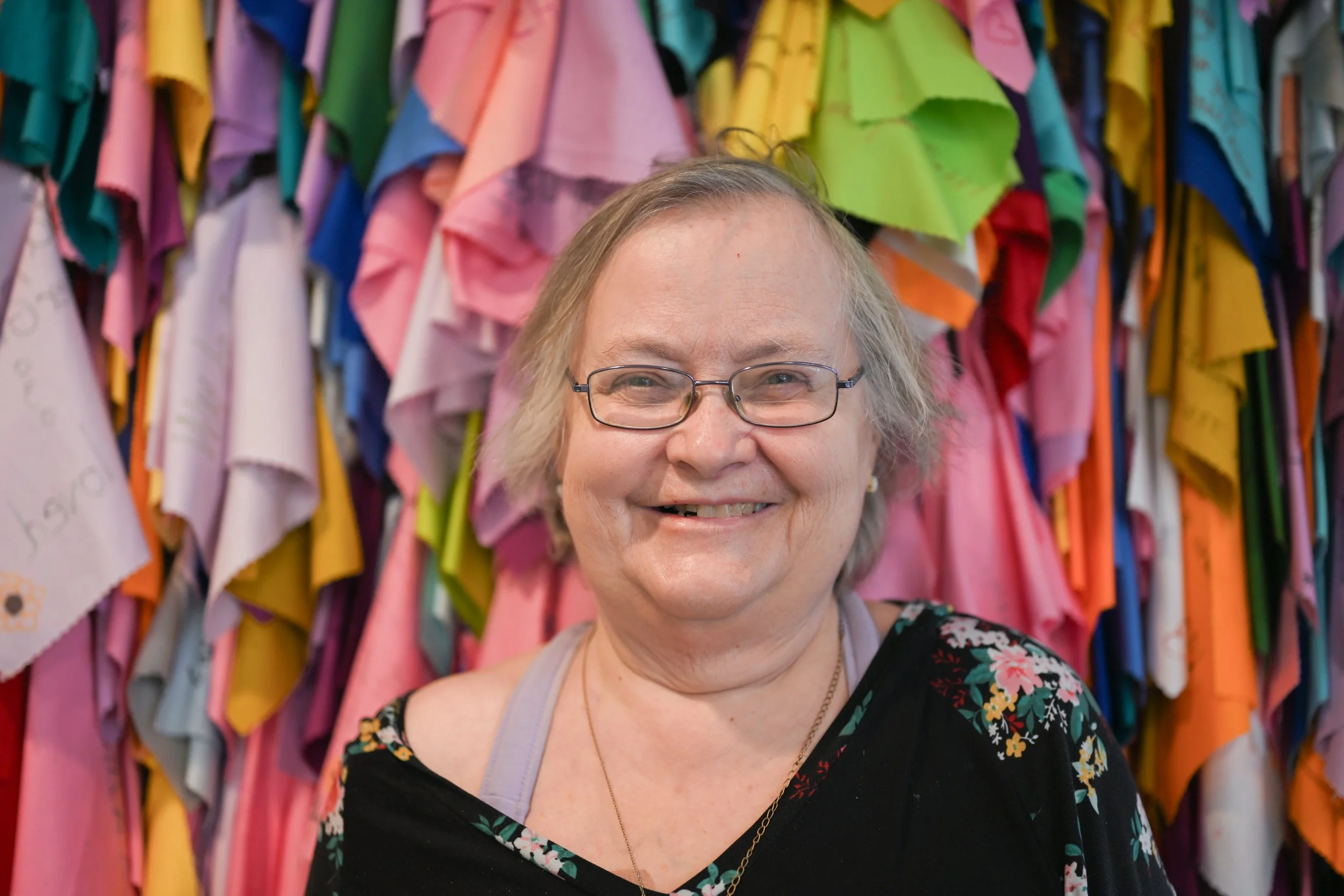 Jackie Brunmett, a client of Little Red Door, poses for a portrait during the agency’s open house event Feb. 19 in Indianapolis.