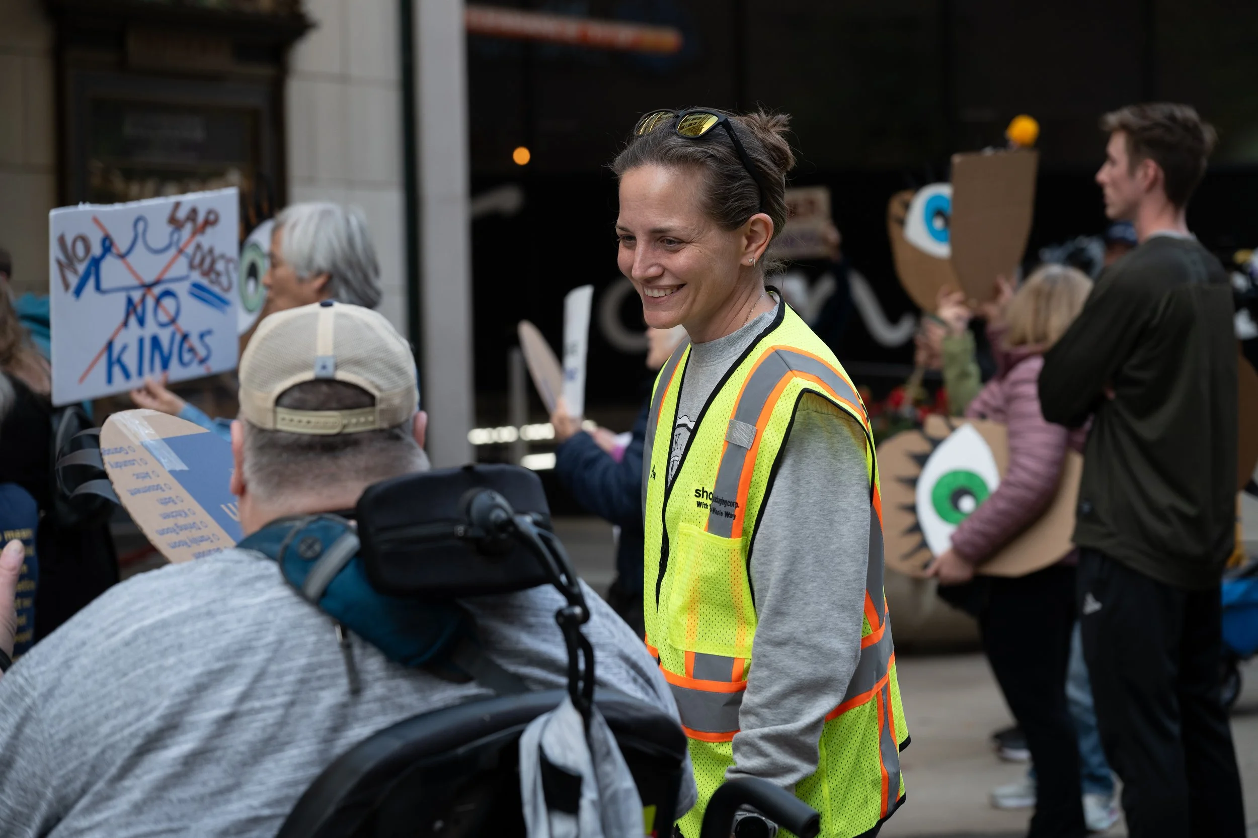 Protest organizer Elizabeth Marvin chatting with a demonstrator during the protest against redistricting October 2025 in downtown Indianapolis.