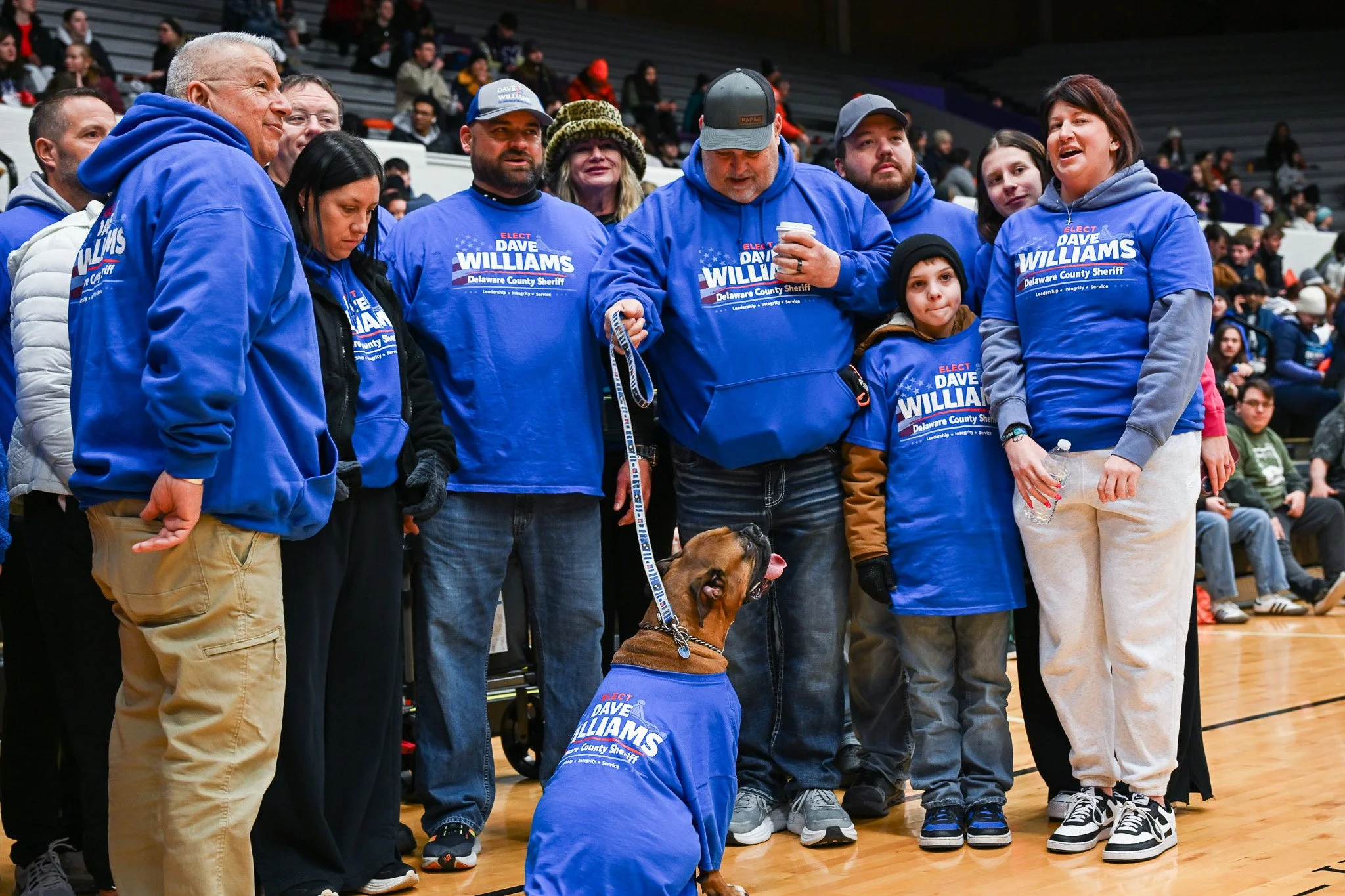 A local candidate for the Delaware County Sheriff and his family gather for a photo during the Muncie Mission Walk a Mile in My Shoes event Feb. 21 in Muncie, Indiana. 