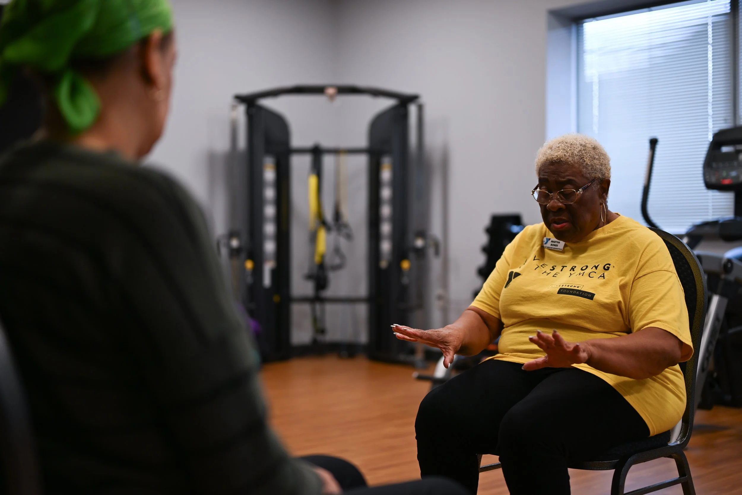 Martha Bonds leads a session of the YMCA’s LIVESTRONG program during the Little Red Door Cancer Agency’s open house event Feb. 19 in Indianapolis.