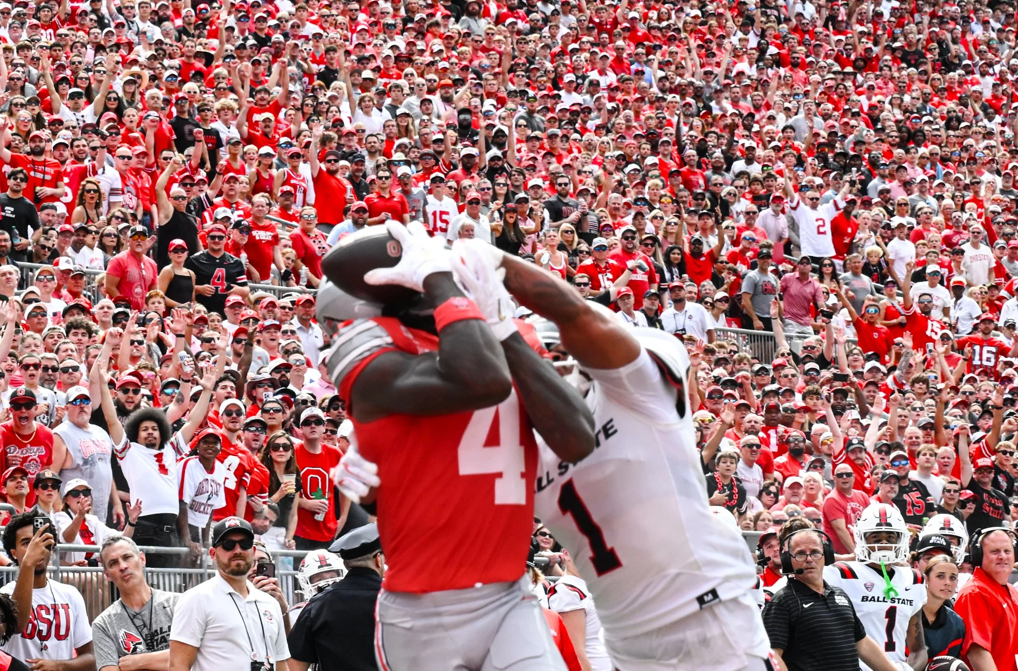 Fans during the Ohio State vs. Ball Stater football game react to two players clashing for the ball Sept. 5 at the Ohio Stadium.