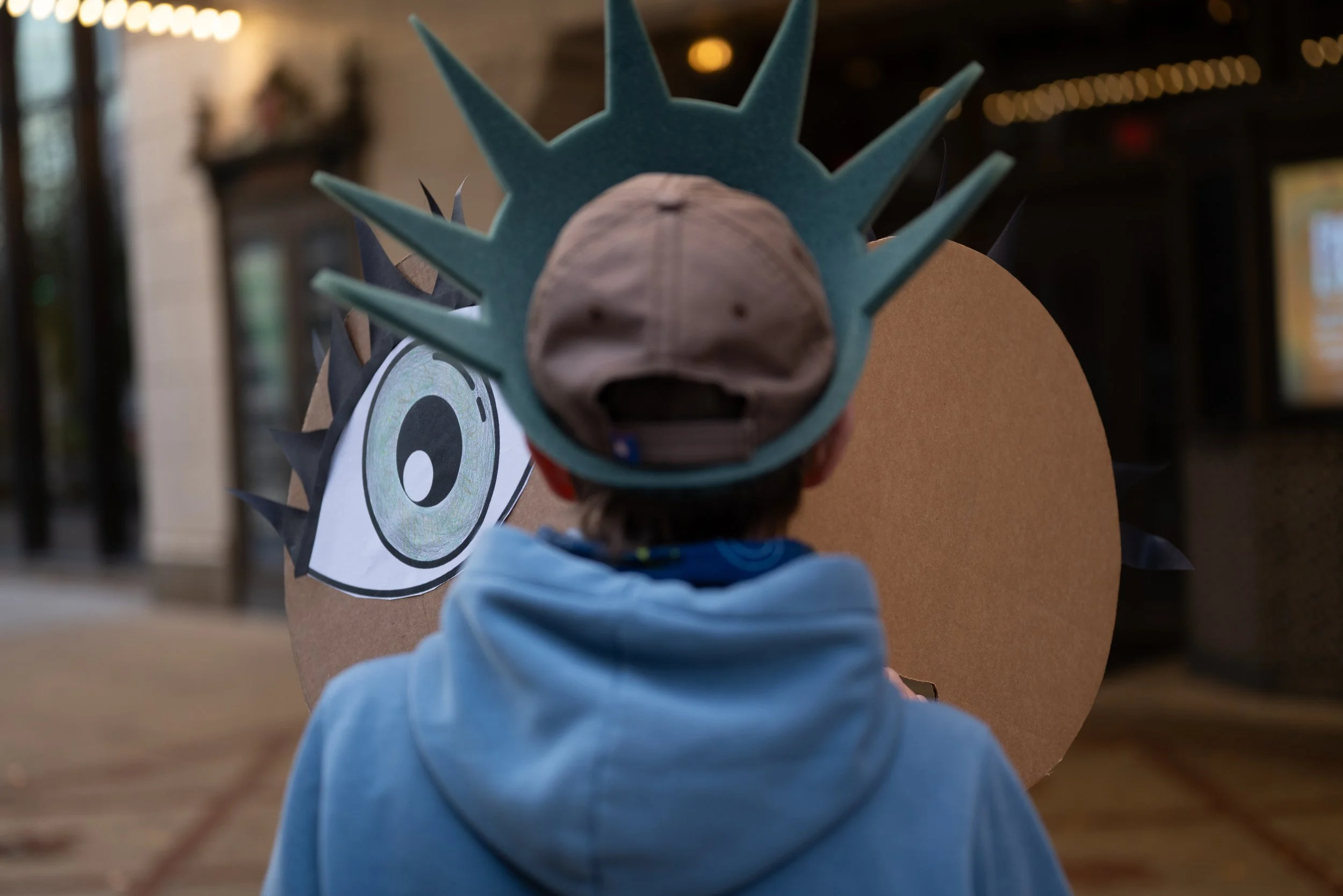 An attendee flashing homemade signage during the protest against redistricting efforts October 2025 in Indianapolis, Indiana.